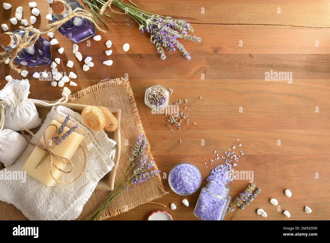 Set of natural lavender body hygiene products on wooden table. Top view. Horizontal composition. Stock Photo