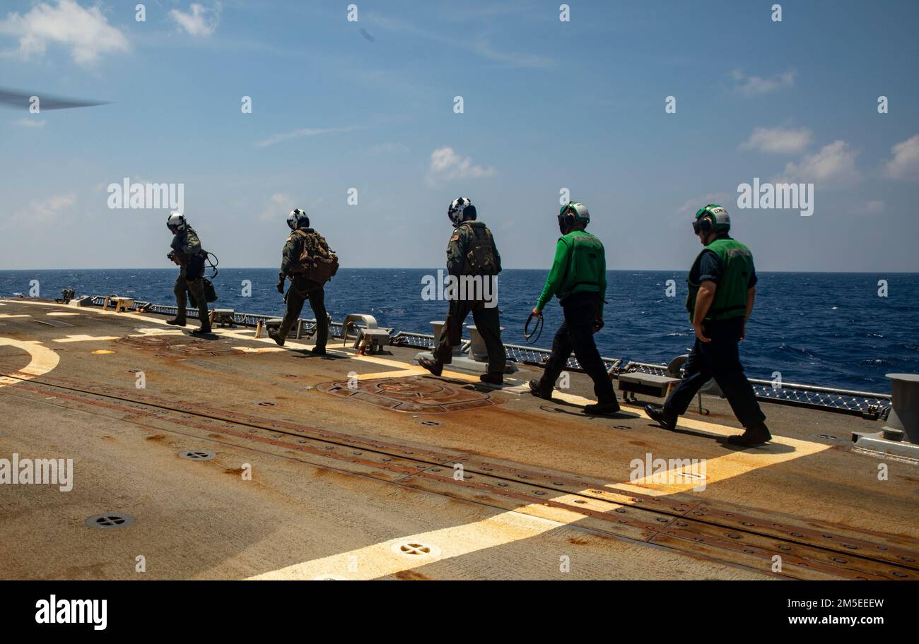 PHILIPPINE SEA (March 7, 2022) Sailors prepare for flight operations aboard Arleigh Burke-class guided-missile destroyer USS Ralph Johnson (DDG 114). Ralph Johnson is assigned to Task Force 71/Destroyer Squadron (DESRON) 15, the Navy’s largest forward-deployed DESRON and the U.S. 7th fleet’s principal surface force. Stock Photo