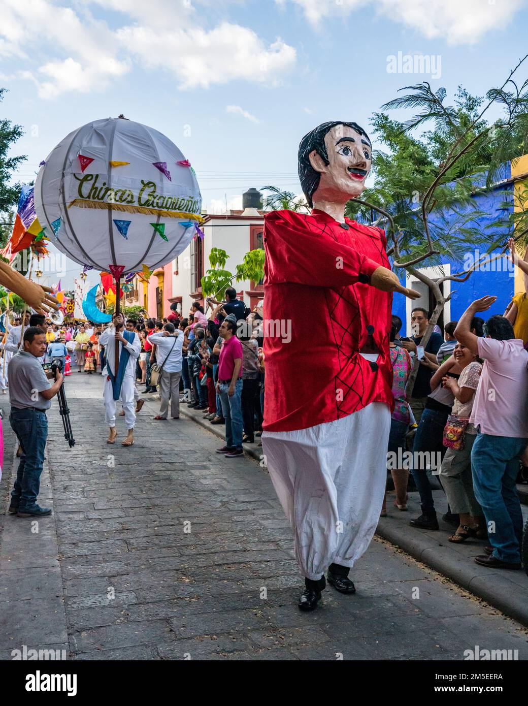 A giant puppet called mono de calenda or parade monkey in a parade during the Guelaguetza dance festival in Oaxaca, Mexico. Stock Photo