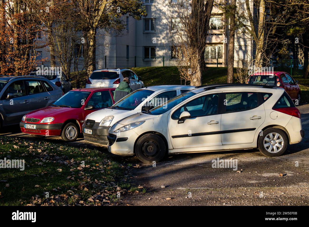 Reims, France - December 27, 2022 Various cars parked in the downtown of Reims, capital of Champagne in France Stock Photo
