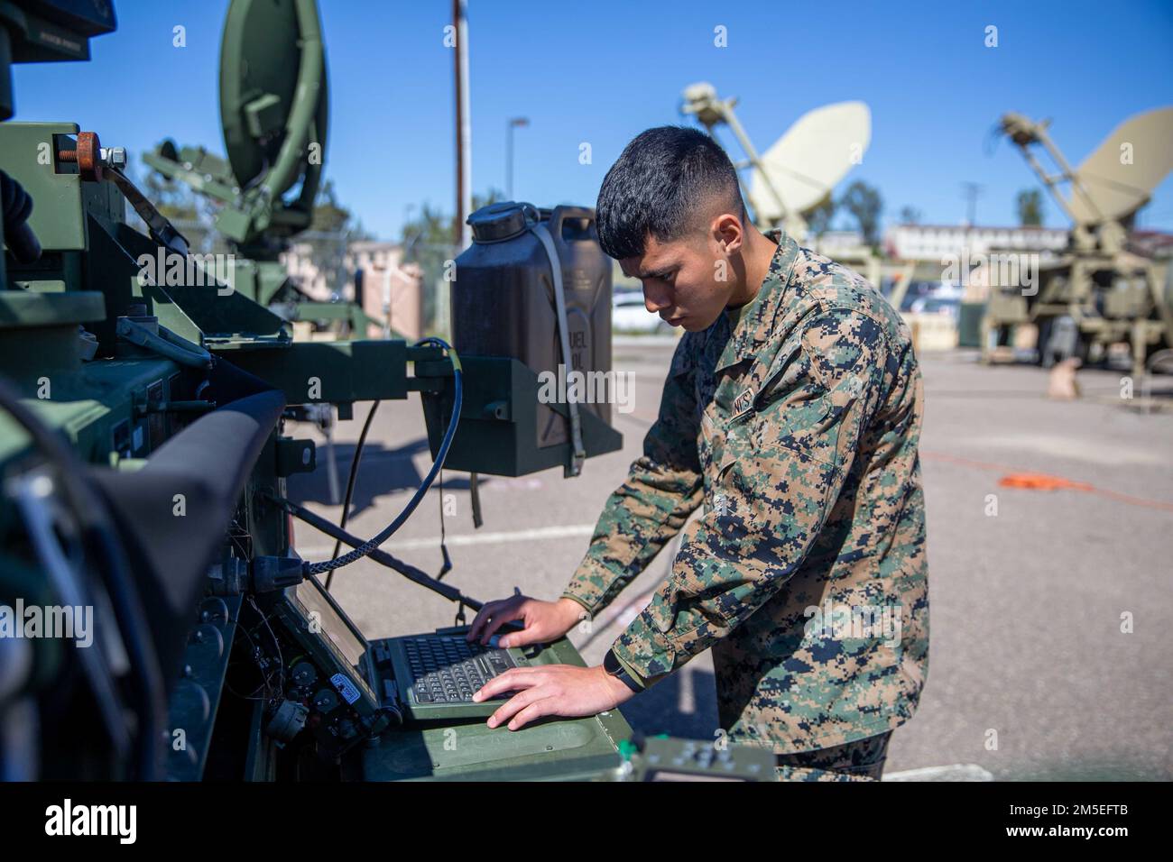U.S. Marine Corps Lance Cpl. Marvin Diaz, a satellite communications operator with 9th Communication Battalion, I Marine Expeditionary Force Information Group, operates on the Secure Mobile Anti-Jam Reliable Tactical Terminal at Marine Corps Base Camp Pendleton, California, March 11, 2022. This training allows the 9th Communication Battalion to be capable of operating, defending, and preserving information networks to enable command and control for the commander in all domains, and support and conduct Marine Air Ground Task Force operations in the information environment. Stock Photo