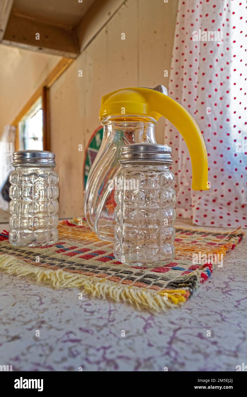 Vintage glass salt and pepper shakers and syrup dispenser Stock Photo