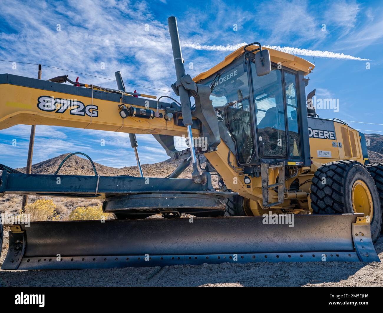 The cab and moldboard on a John Deere 872G Motor Grader near Big Pine