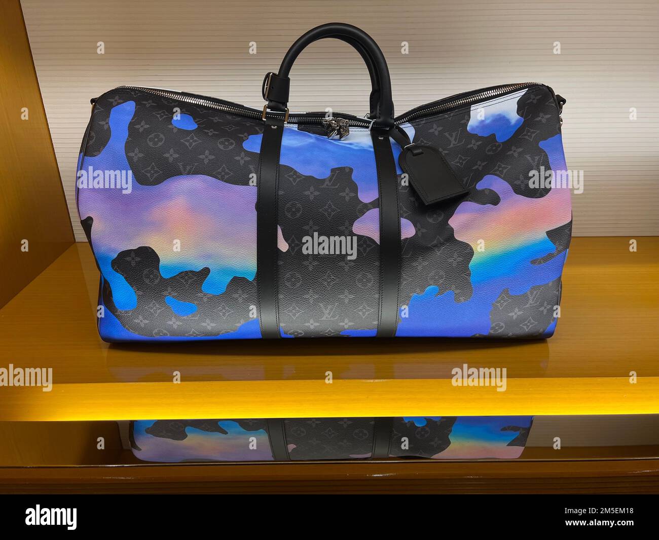 Honolulu, HI - December 26, 2022: Luxury Louis Vuitton Multicolor men's Keepall duffle of display in Waikiki boutique Stock Photo