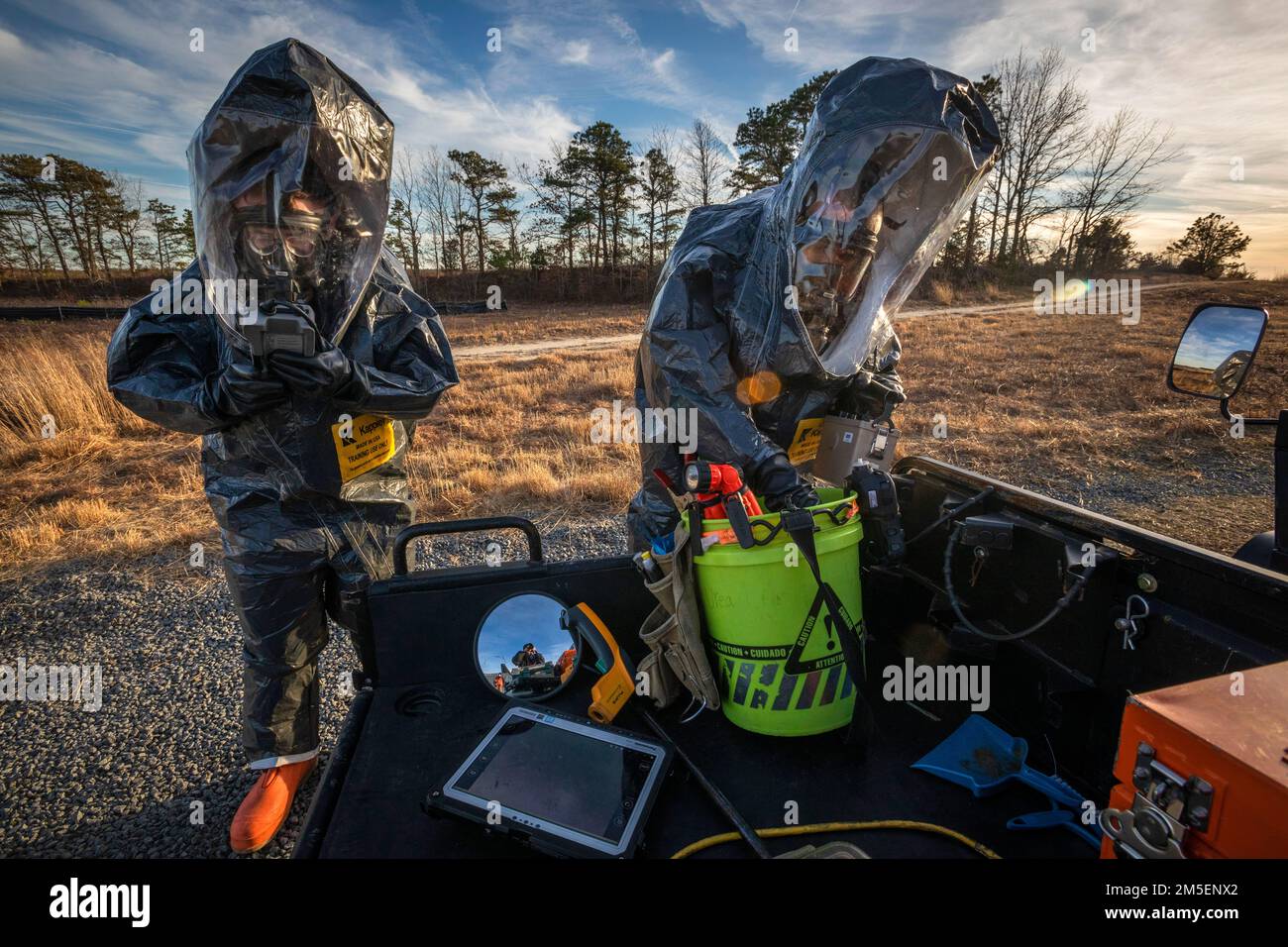 U.S. Army Sgt. Eric Boyer, left, and Staff Sgt. Nicky Lam, both survey team members with the 21st Weapons of Mass Destruction-Civil Support Team (21st WMD-CST), New Jersey National Guard, prepare to enter a simulated crime scene during an Army North training exercise at the William J. Hughes Technical Center, Federal Aviation Administration, Egg Harbor Township, New Jersey, March 3, 2022. The 21st identifies chemical, biological, radiological, and nuclear substances; assesses and advises civil authorities on response measures to man-made or natural disasters. (New Jersey National Guard photo b Stock Photo
