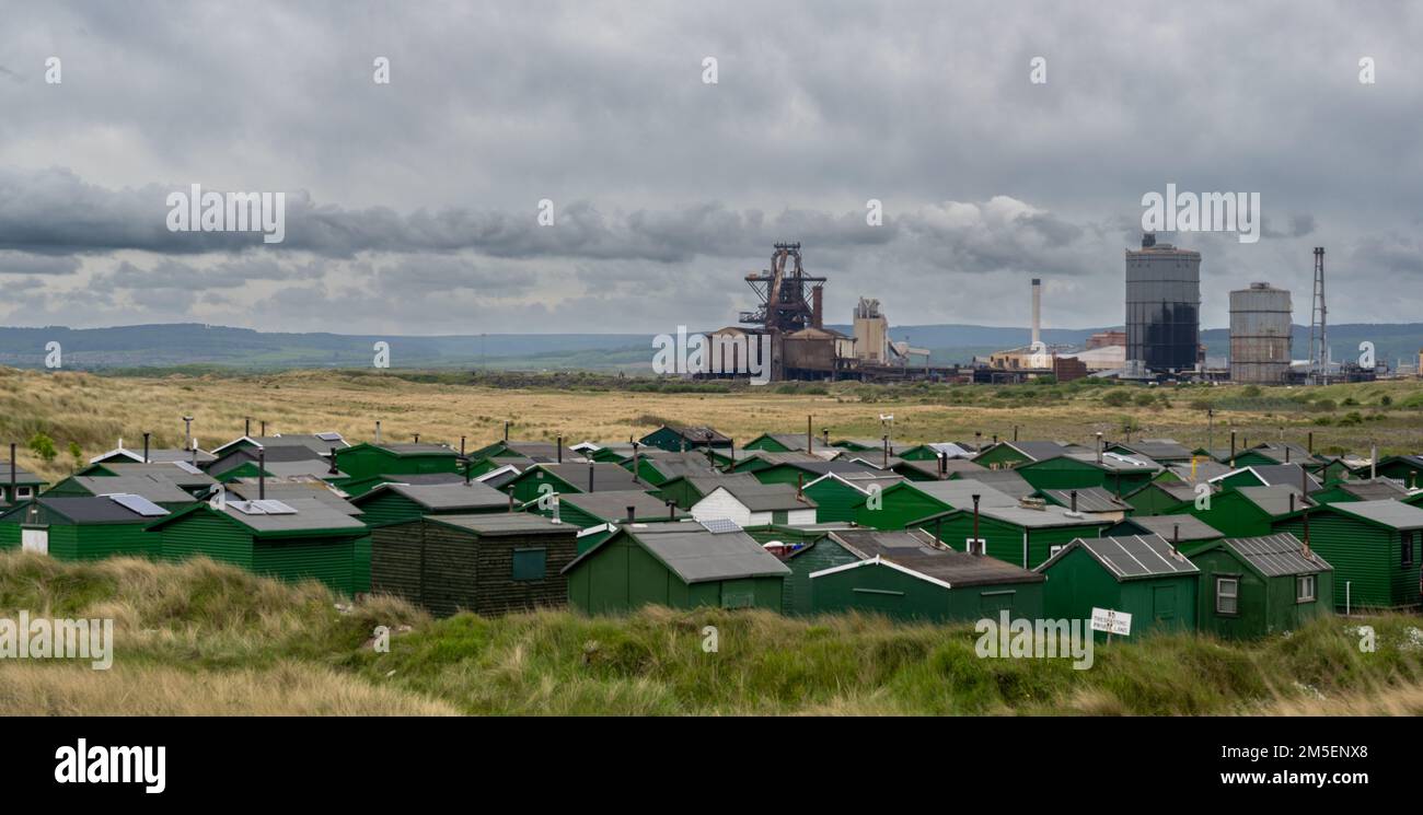 Recently demolished Warrenby steelworks seen across South Gare fishermans huts Stock Photo