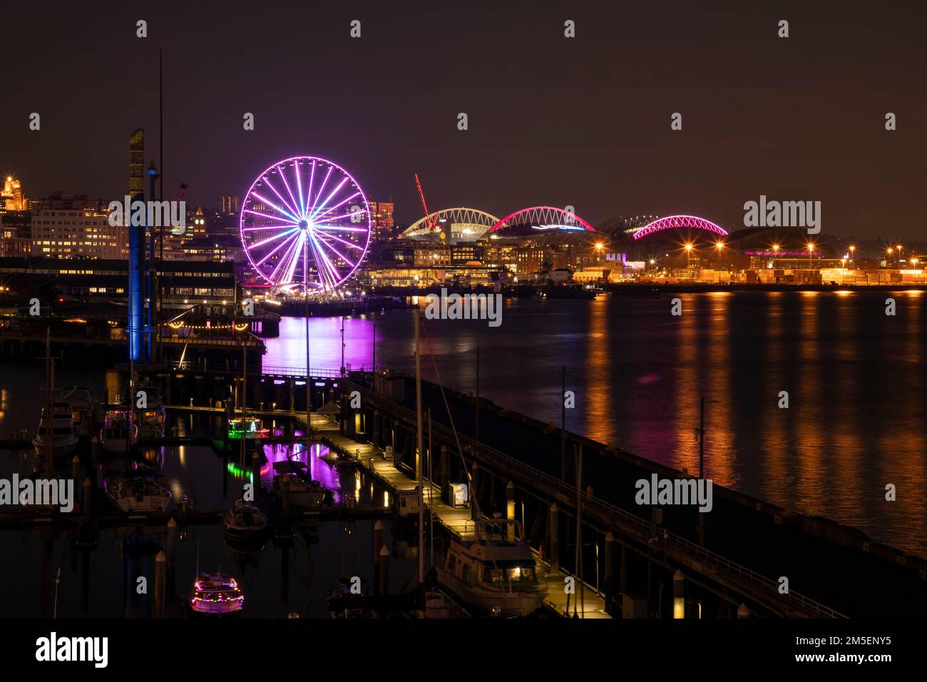 WA22888-00...WASHINGTON - The Seattle waterfront with  the Bell Harbor Marina, the Seattle Great Wheel., the stadiums and the Port of Seattle. Stock Photo