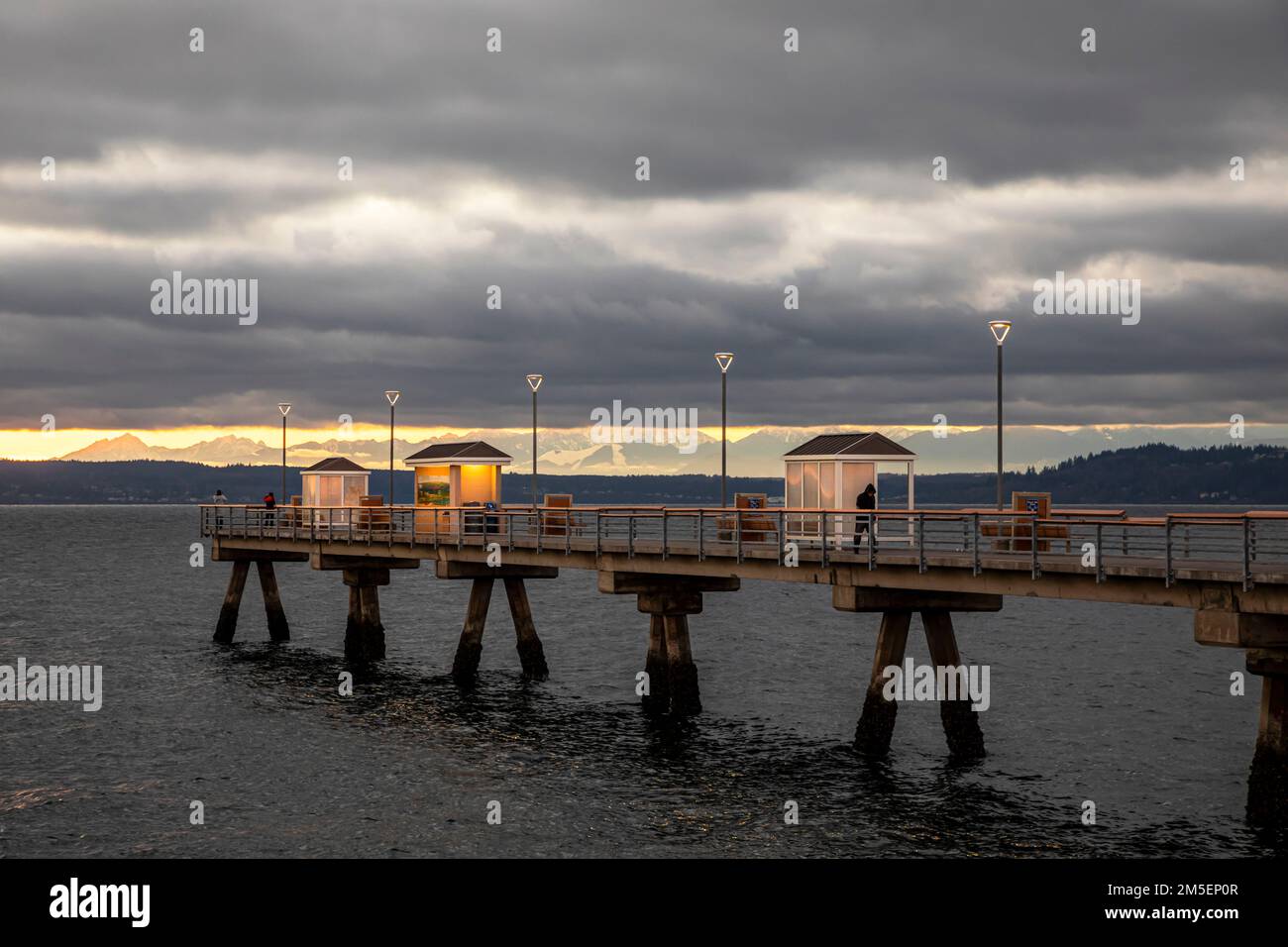 WA22897-00...WASHINGTON - The Edmonds Fishing Pier in the Salish Sea/Puget Sound with the Olympic Mountain Range beyond. Stock Photo