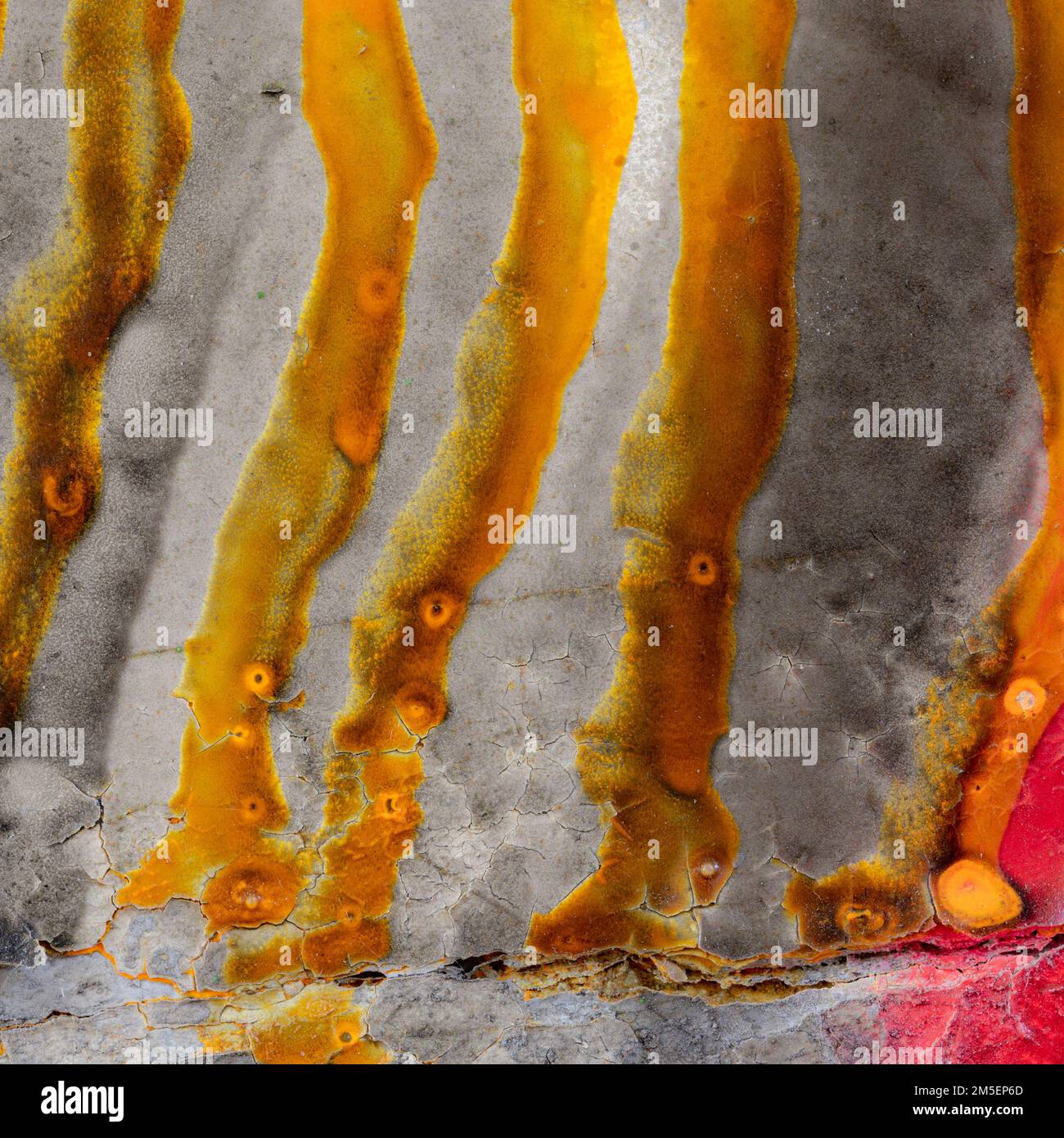 Abstract square image of gold coloured paint runs Stock Photo Alamy