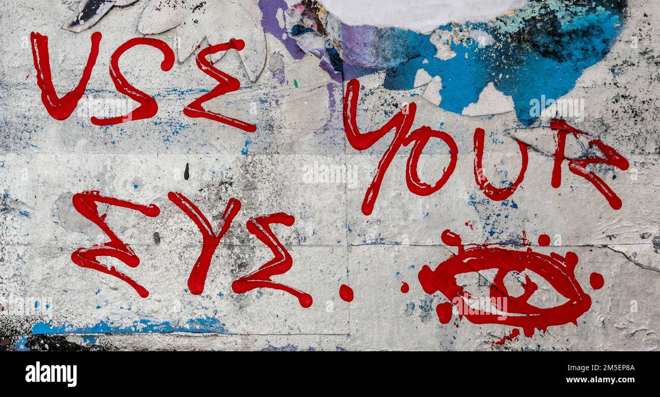 Red writing on a cream brick wall Stock Photo - Alamy