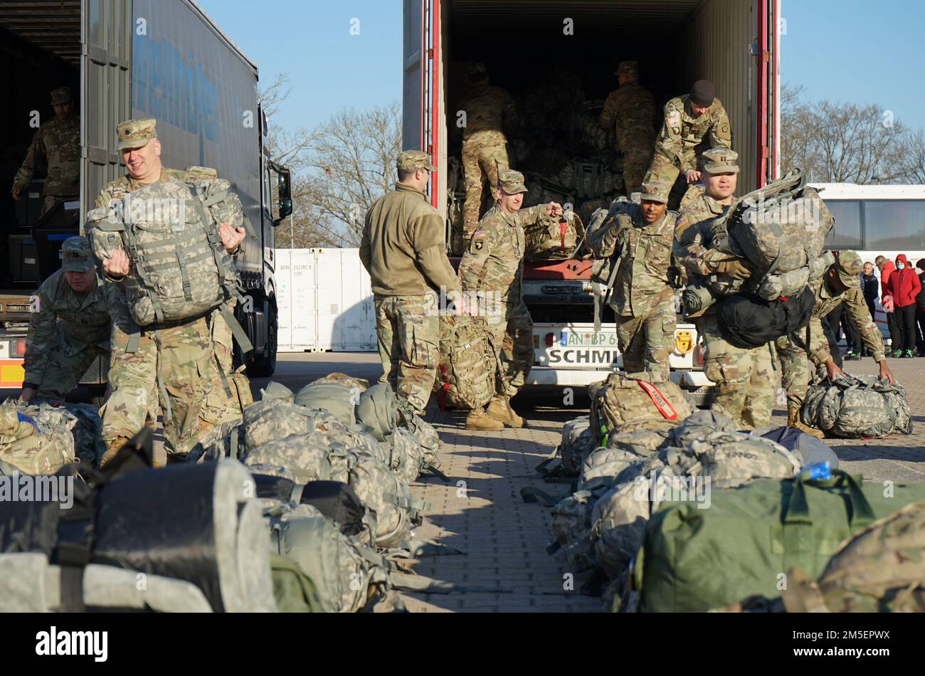 Soldiers from V Corps, Fort Knox, Ky., disembark from buses on Barton Barracks, Ansbach, Germany, March 8, 2022, as part of a deployment to Germany to build readiness, improve interoperability, reinforce allies and deter further Russian aggression. The deployment of U.S. forces here is a prudent measure that underpins NATO’s collective war-prevention aims, defensive orientation and commitment to protect all Allies. Stock Photo