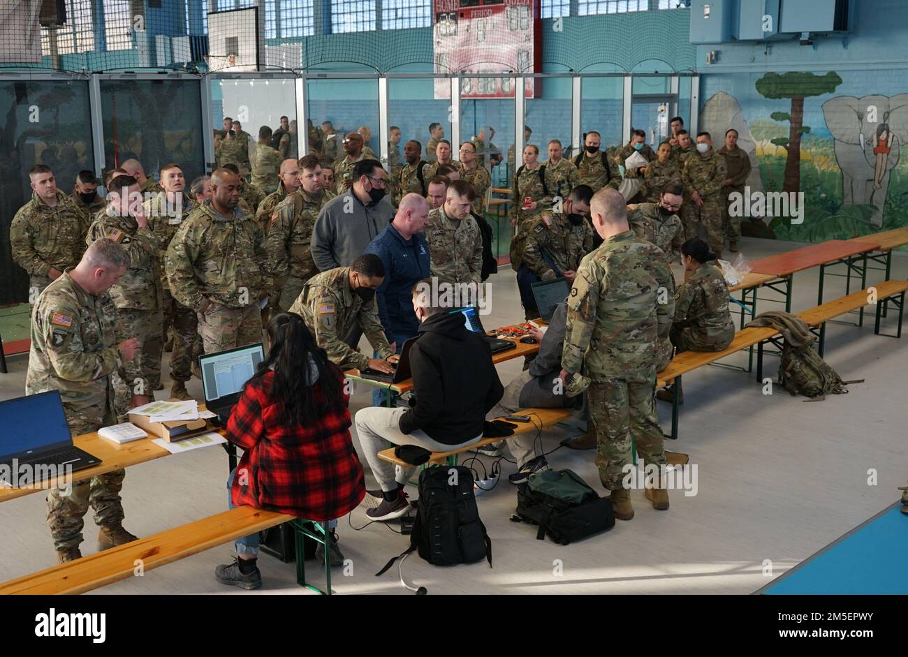 Soldiers from V Corps, Fort Knox, Ky., get their room assignments on Barton Barracks, Ansbach, Germany, March 8, 2022, as part of a deployment to Germany to build readiness, improve interoperability, reinforce allies and deter further Russian aggression. The deployment of U.S. forces here is a prudent measure that underpins NATO’s collective war-prevention aims, defensive orientation and commitment to protect all Allies. Stock Photo