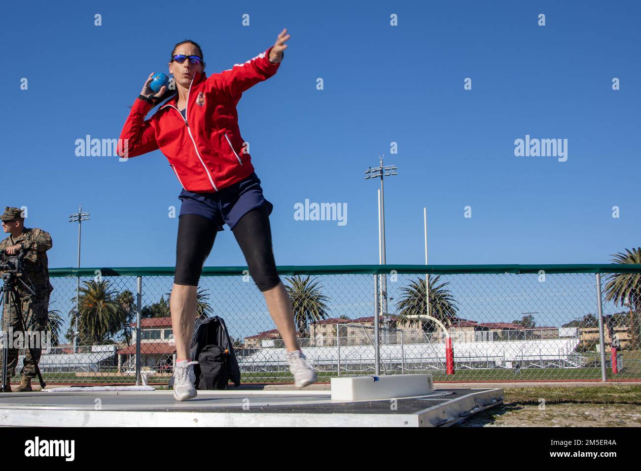 Retired U.S. Marine Corps Maj. Lisa Doring throws a shot put at Page field house during the 2020 West Coast Marine Corps Trials (MCT) track and field event on Marine Corps Base Camp Pendleton, California, March 8, 2022. The MCT is an adaptive sports event involving more than 75 wounded, ill, or injured Marines, Sailors, veterans, and international competitors. Stock Photo