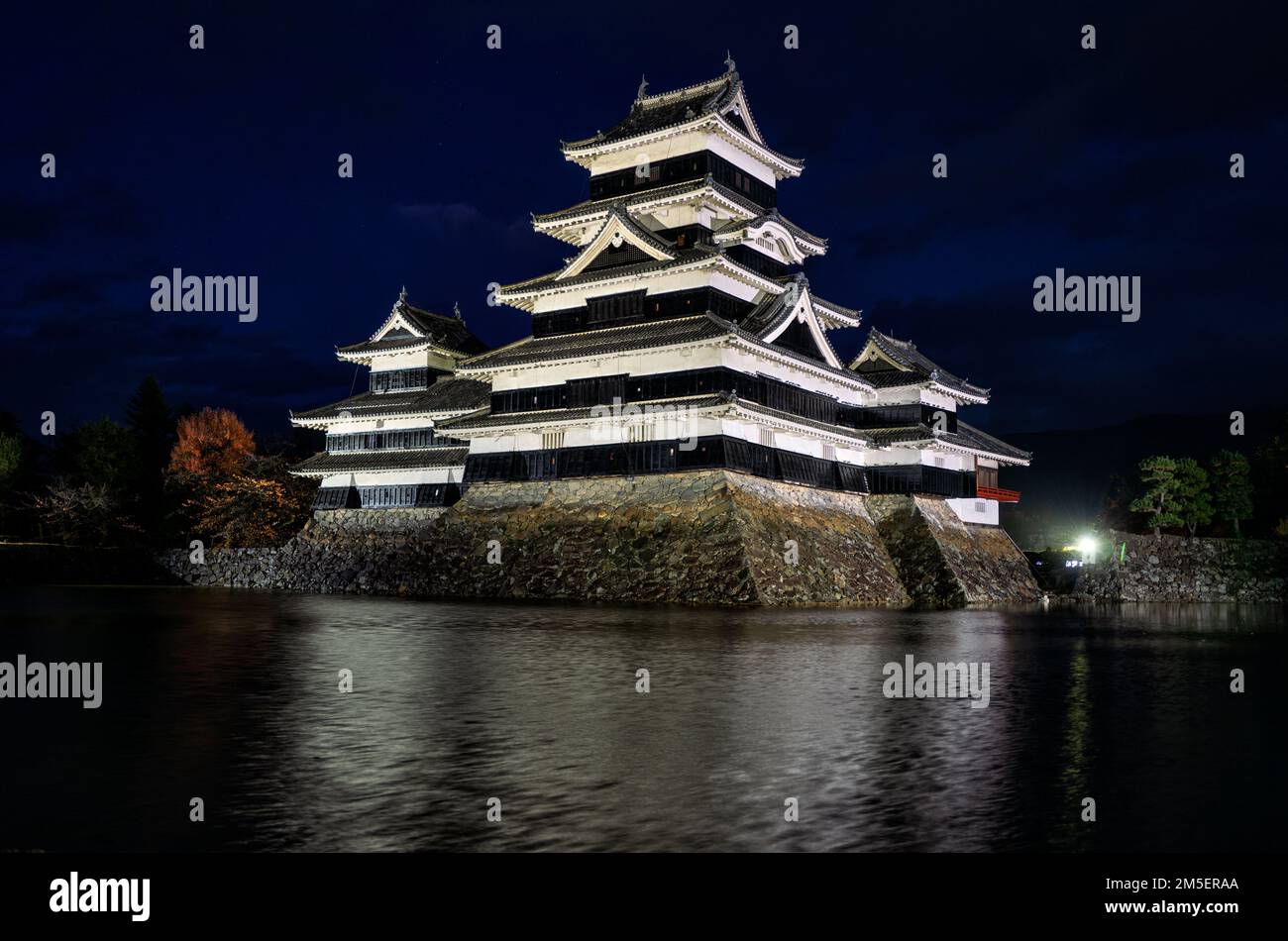 Matsumoto Castle illuminated at night, Japan Stock Photo