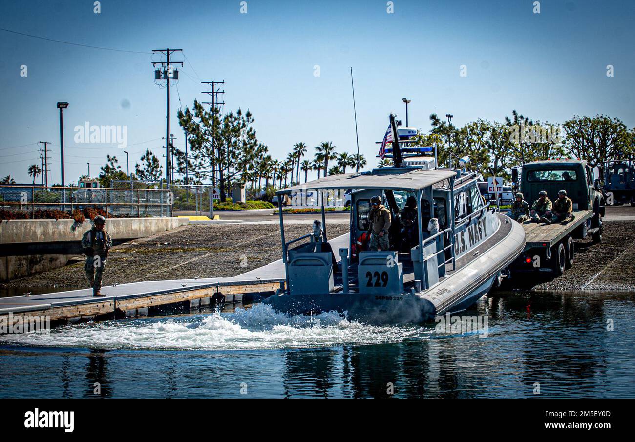 220309-N-NT795-448 SEAL BEACH, Calif. (March 9, 2022) Sailors assigned to Maritime Expeditionary Security Squadron (MSRON) 11 launch a 34-foot Sea Ark patrol boat during boat crewman training as part of Maritime Expeditionary Security Force (MESF) Boat University Basic-Course. MESF is a core Navy capability that provides port and harbor security, high value asset security, and maritime security in the coastal and inland waterways. Stock Photo