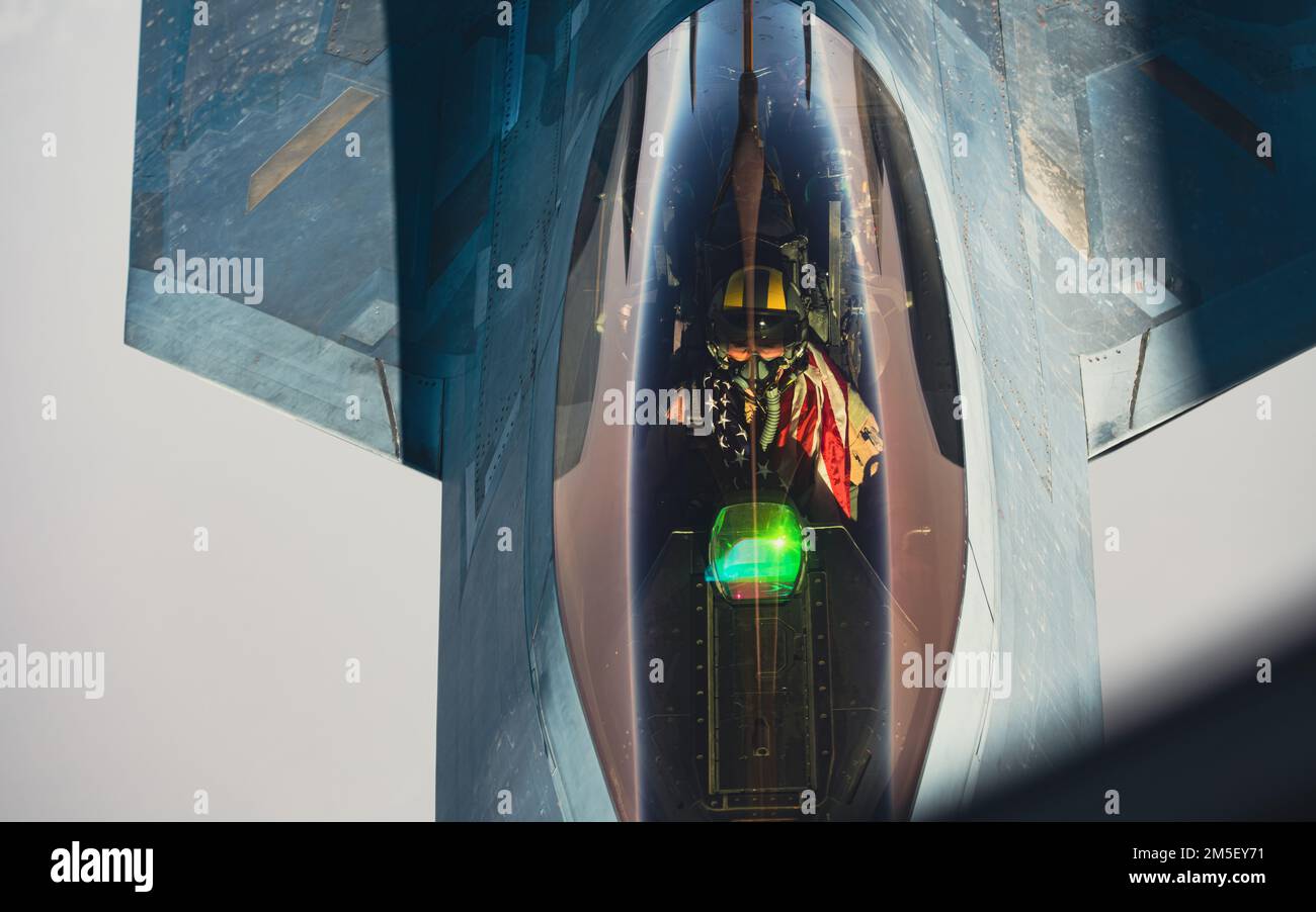 A U.S. Air Force F-22 Raptor pilot assigned to the 380th Air Expeditionary Wing, flies over Southwest Asia, March 9, 2022. The F-22 Raptor is a fifth-generation aircraft that combines stealth, supercruise, maneuverability, integrated avionics, and is designed to project air dominance, rapidly and at great distances and deter regional aggressors while deployed in the U.S. Central Command area of responsibility. Stock Photo