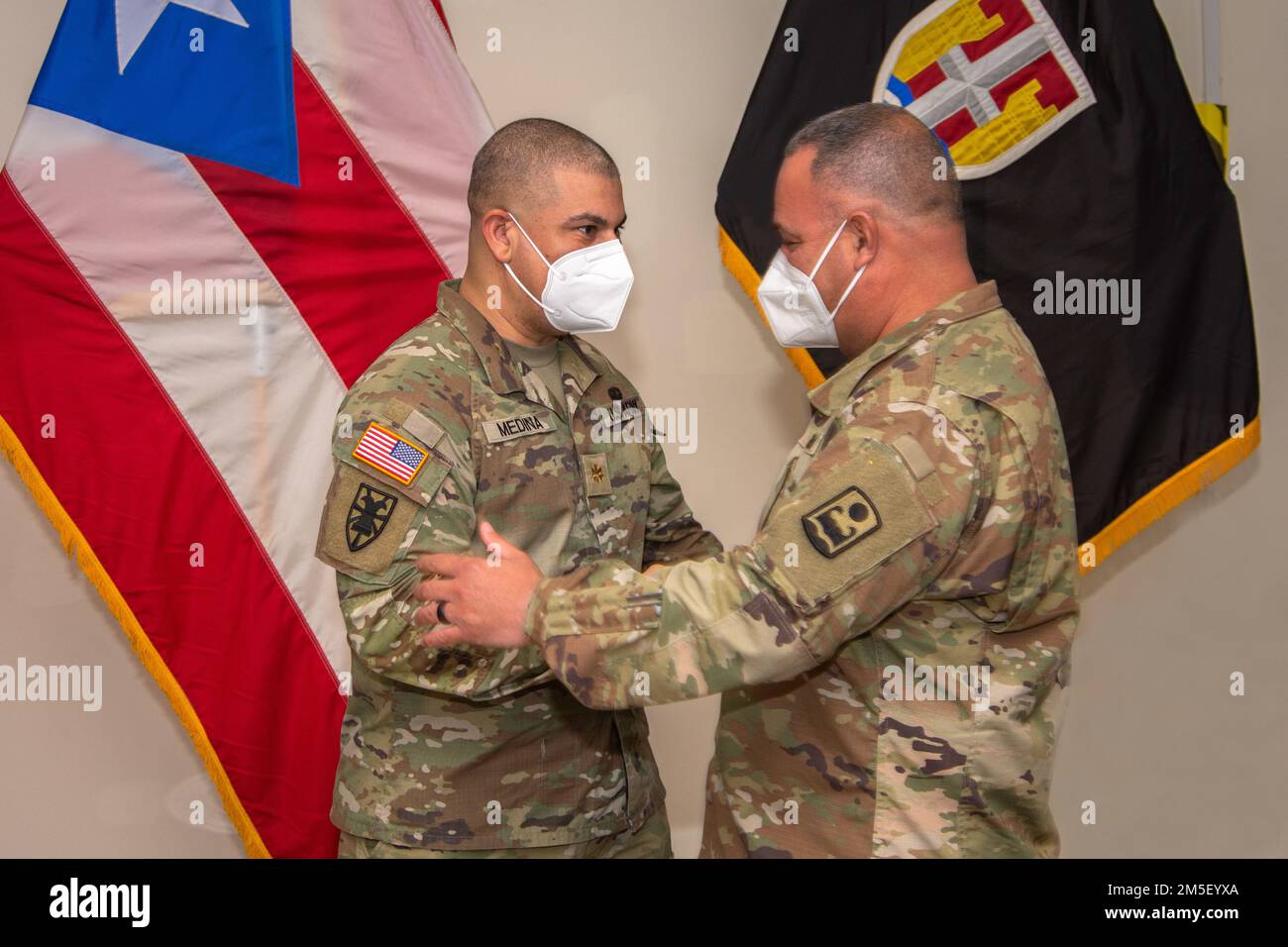 Master Sgt. José J. Fuentes congratules Major Luis E. Medina after his promotion ceremony at Fort Buchanan, March 9, 2022. The Puerto Rico Army National Guard requires capable and effective officers to lead and instruct our soldiers in the day-to-day operations. Stock Photo