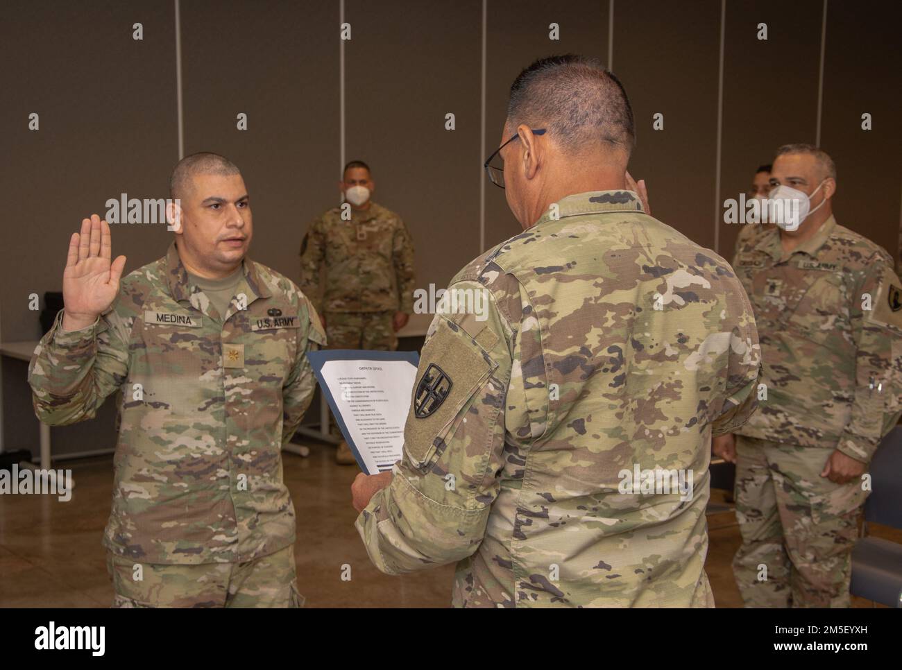 Colonel Víctor Pérez, commander of the Joint Task Force - Puerto Rico, administers the oath of office to Maj. Luis E. Medina at Fort Buchanan, Puerto Rico, March 9, 2022. The Puerto Rico Army National Guard requires capable and effective officers to lead and instruct our soldiers in the day-to-day operations. Stock Photo
