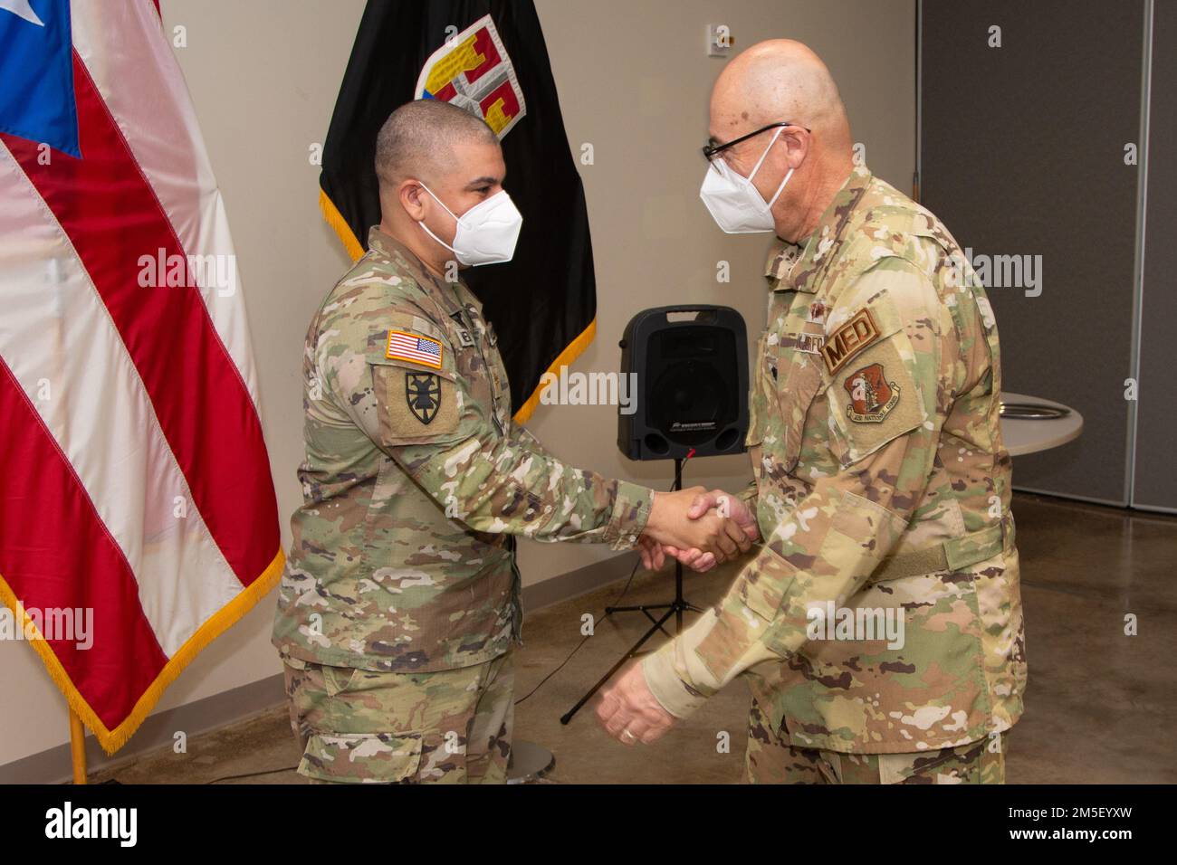 Lt. Col. Francisco Nieves greets Major Luis E. Medina during his promotion ceremony at Fort Bucanan, Puerto Rico, March 9, 2022. The Puerto Rico Army National Guard requires capable and effective officers to lead and instruct our soldiers in the day-to-day operations. Stock Photo