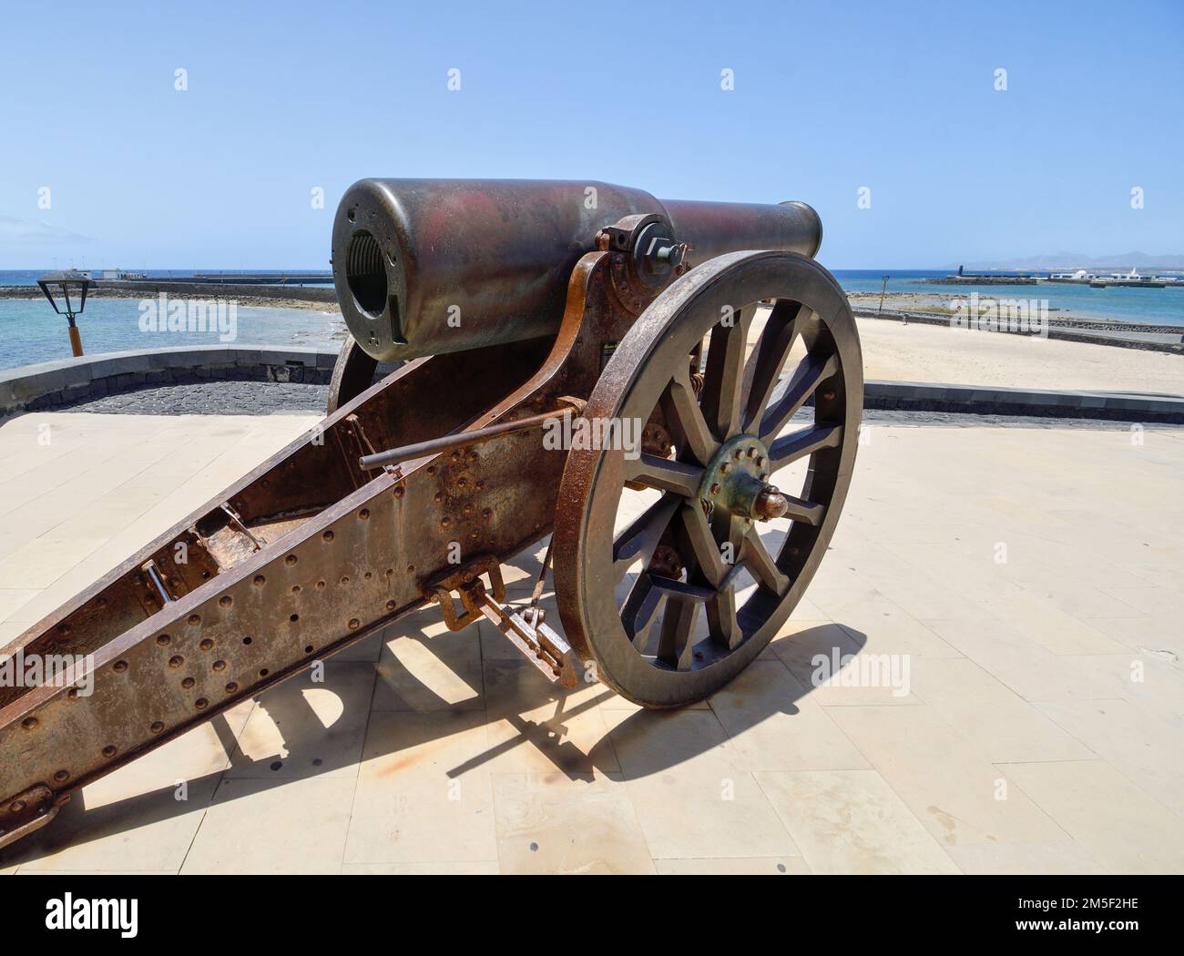 Old cannon of the Castillo de San Gabriel in Arrecife pointing towards the bay Stock Photo