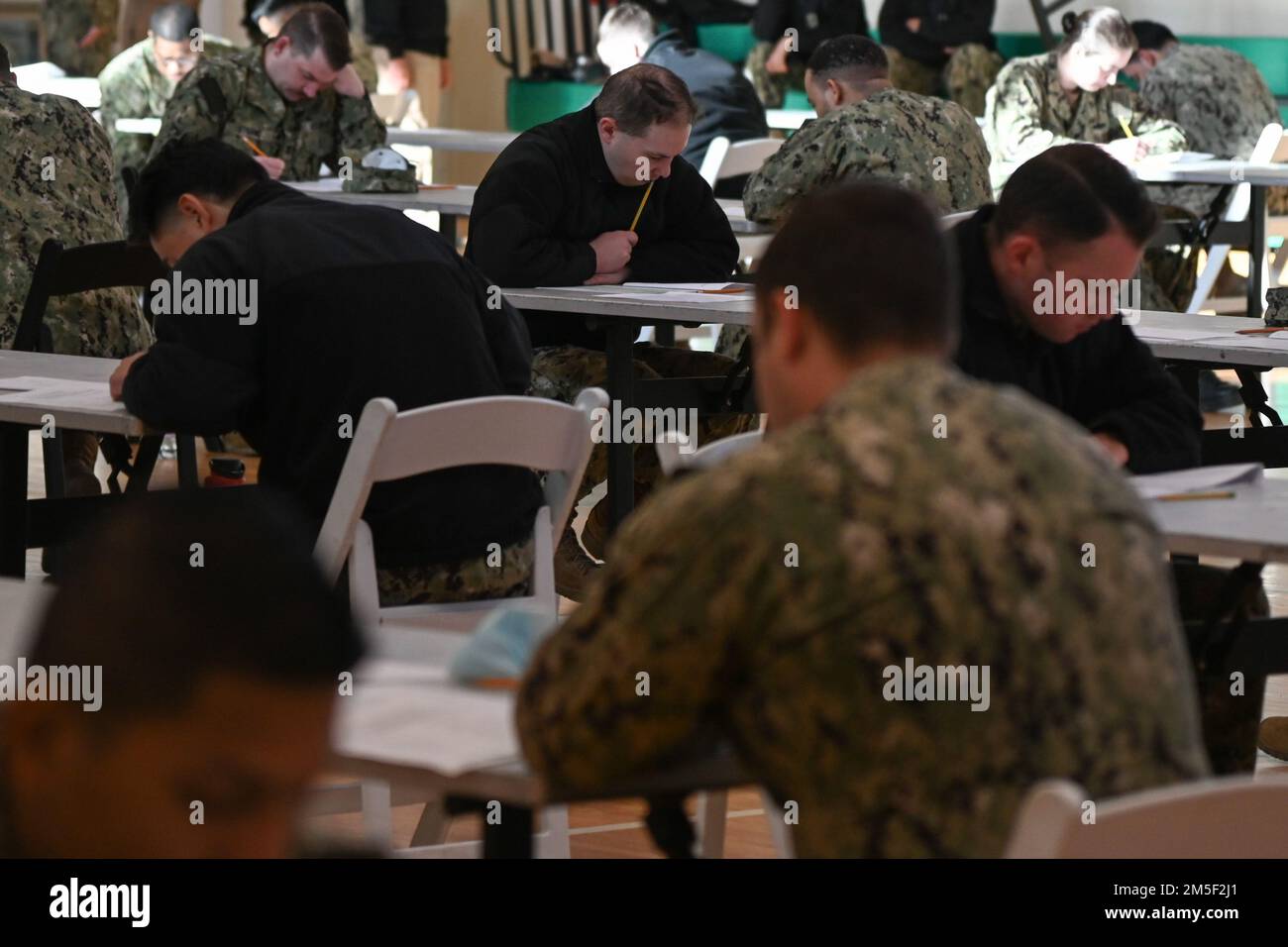 220310-N-GK686-1028 NAVAL AIR STATION SIGONELLA, Italy (Mar. 10,  2022) -- Aviation Maintenance Administration 2nd Class Cody Mason takes the Navy-wide E-6 advancement examination on Naval Air Station Sigonella, March 10, 2022. NAS Sigonella’s strategic location enables U.S., allied, and partner nation forces to deploy and respond as required to ensure security and stability in Europe, Africa and Central Command. Stock Photo