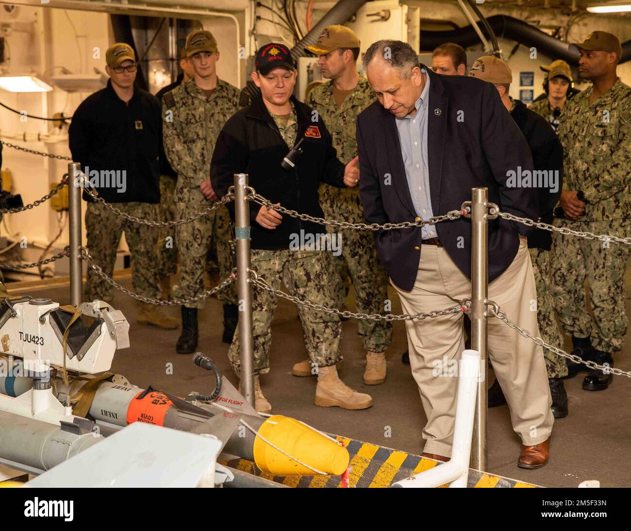 Secretary of the Navy the Carlos Del Toro receives a brief from Lt ...