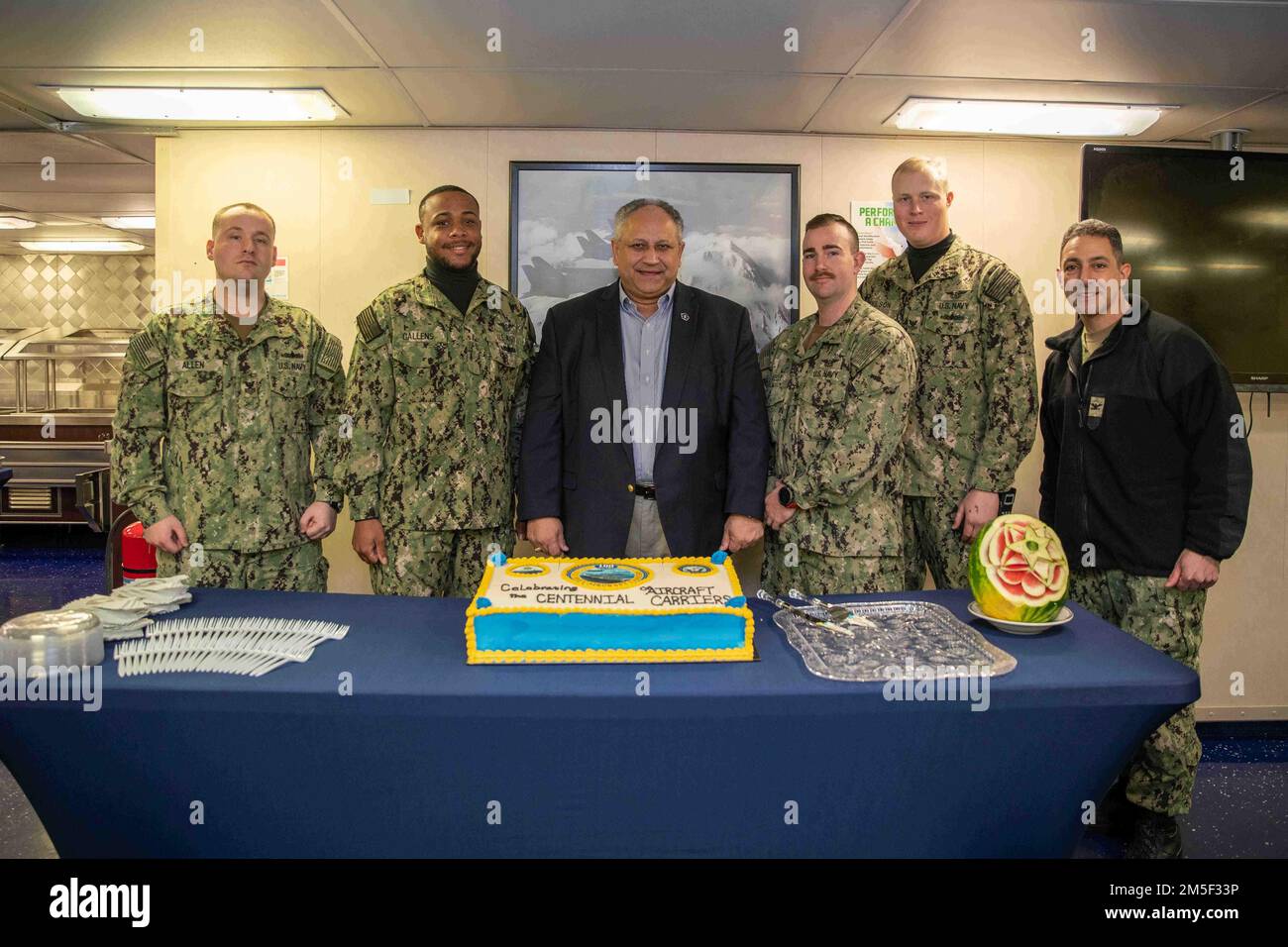 Secretary of the Navy Carlos Del Toro and Capt. Paul Lanzilotta, right ...