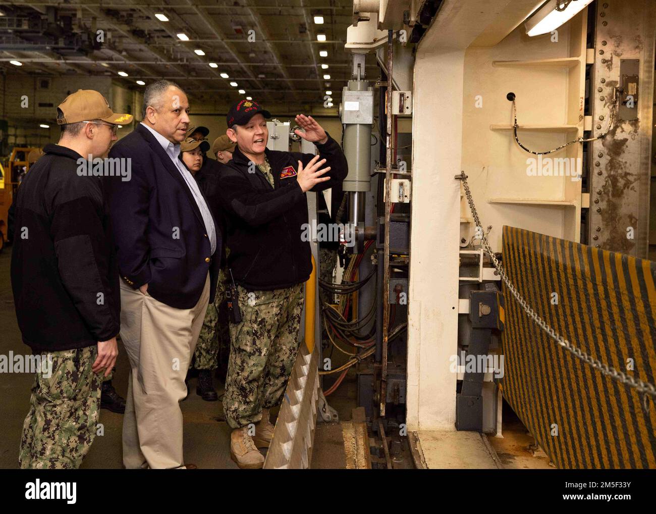 Secretary of the Navy Carlos Del Toro receives a brief from Lt. Cmdr ...
