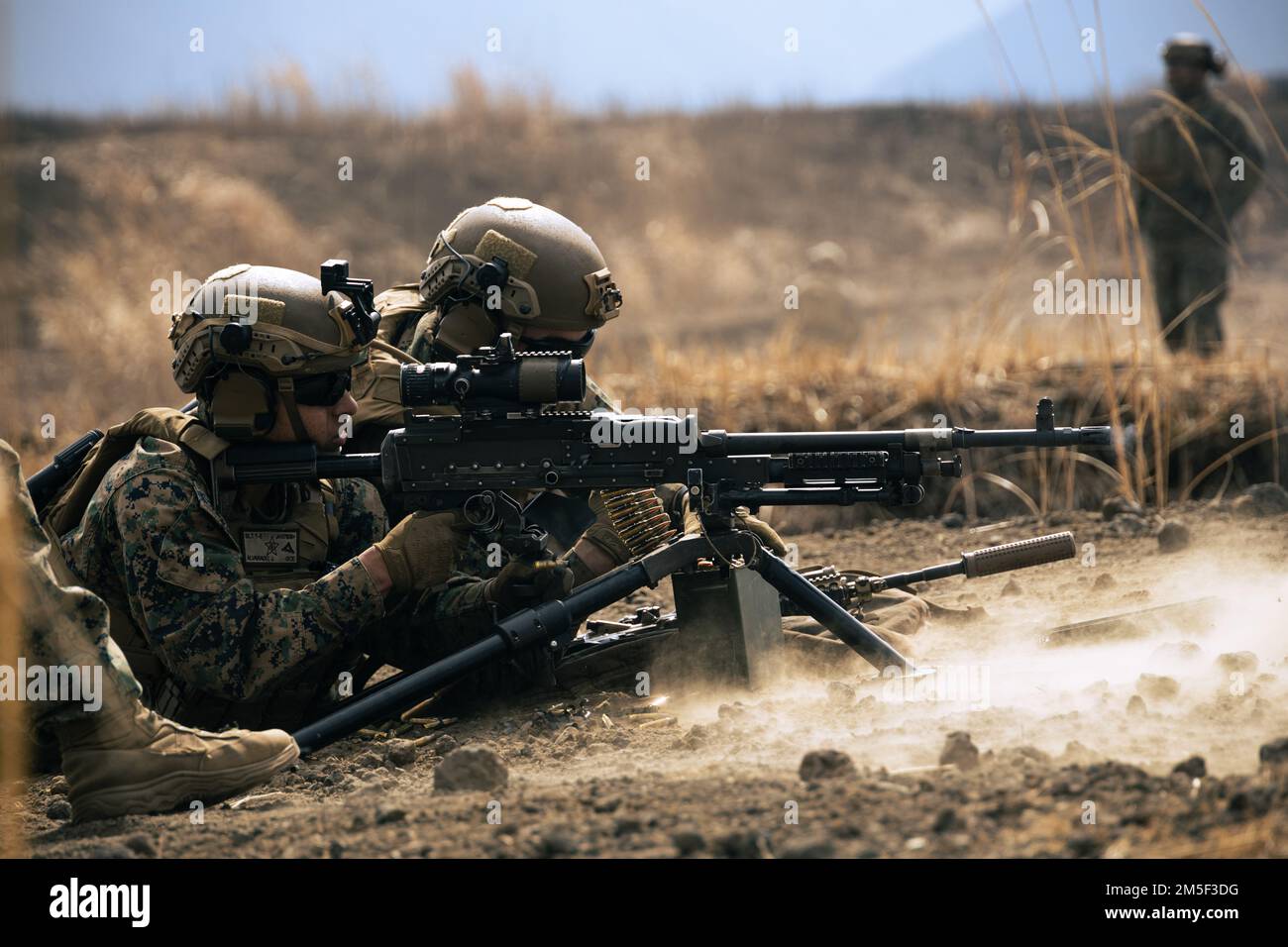U.S. Marines with Battalion Landing Team 1/5, 31st Marine Expeditionary Unit, fire an M240B machine gun during a live-fire exercise on Combined Arms Training Center Camp Fuji, Shizuoka Prefecture, Japan, Mar. 11, 2022. Live-fire drills and exercises keep Marines consistent in the execution of their roles within their squads. Maritime Defense Exercise Amphibious Rapid Deployment Brigade is a bilateral exercise meant to increase interoperability and strengthen ties between U.S. and Japanese forces for the defense of Japan. Stock Photo