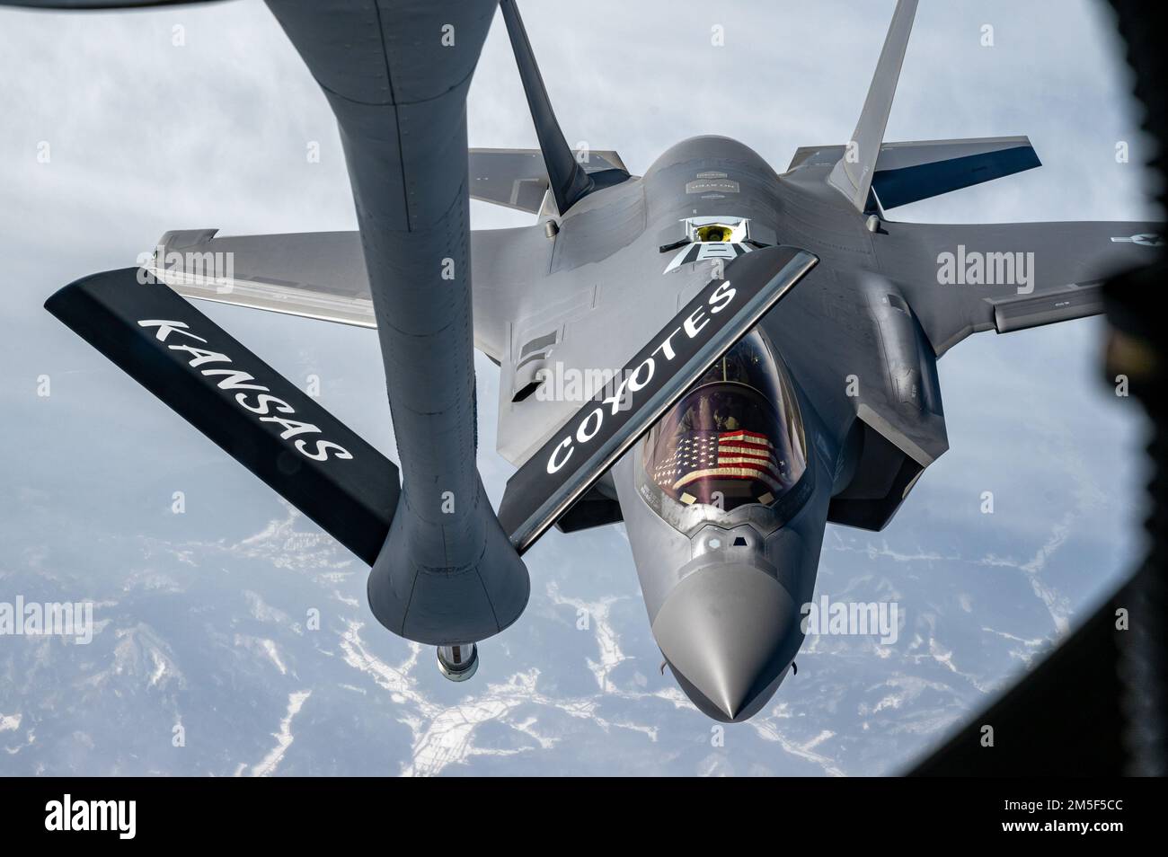 An F-35A Lightning II from the 354th Fighter Wing, Eielson Air Force Base, Alaska, approaches a KC-135 Stratotanker assigned to the 117th Air Refueling Squadron, Forbes Field Air National Guard Base, Kansas, over the Indo-Pacific, March 10, 2022. The F-35As are currently deployed to Kadena Air Base, Japan, conducting integrated operations with joint partners and allies to ensure a free and open Indo-Pacific region. Stock Photo