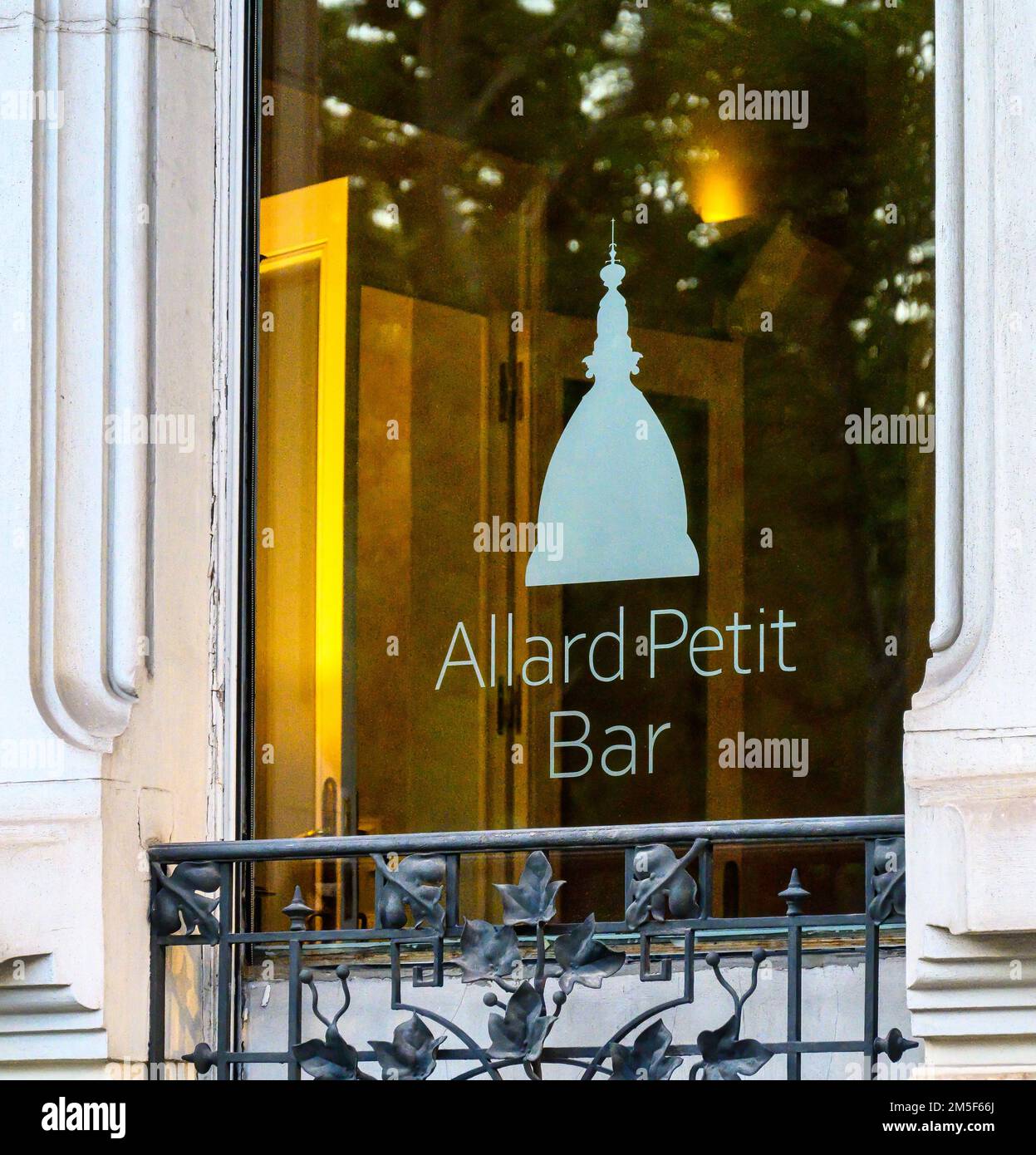 Logo and sign of the Allard Petit bar in a building window. Stock Photo