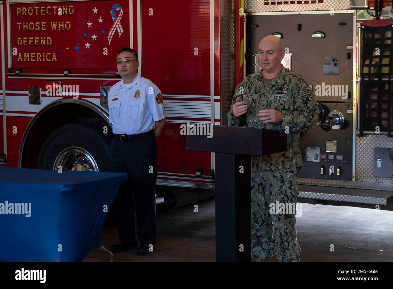 220310-N-OT701-1058 SCHOFIELD BARRACKS (March 10, 2022) Rear Adm. Timothy Kott, commander, Navy Region Hawaii (CNRH), speaks during a ceremony held at Federal Fire Department Fire Station 15 on Schofield Barracks. CNRH District 2 North was recognized for being named the 2021 Navy Medium Fire Department of the Year. Stock Photo