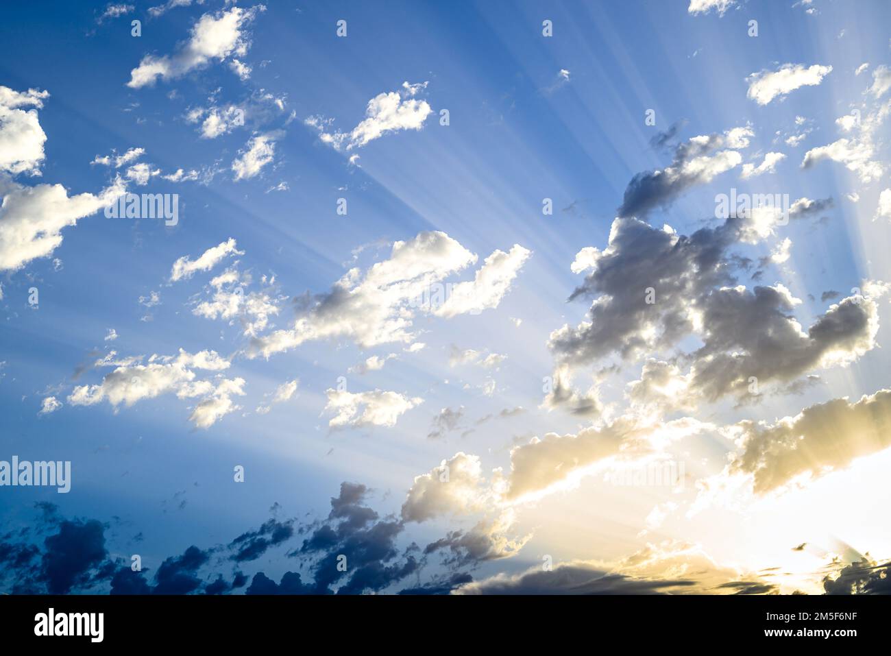 Colorful hot air balloon flying over blue sky with white clouds Stock ...