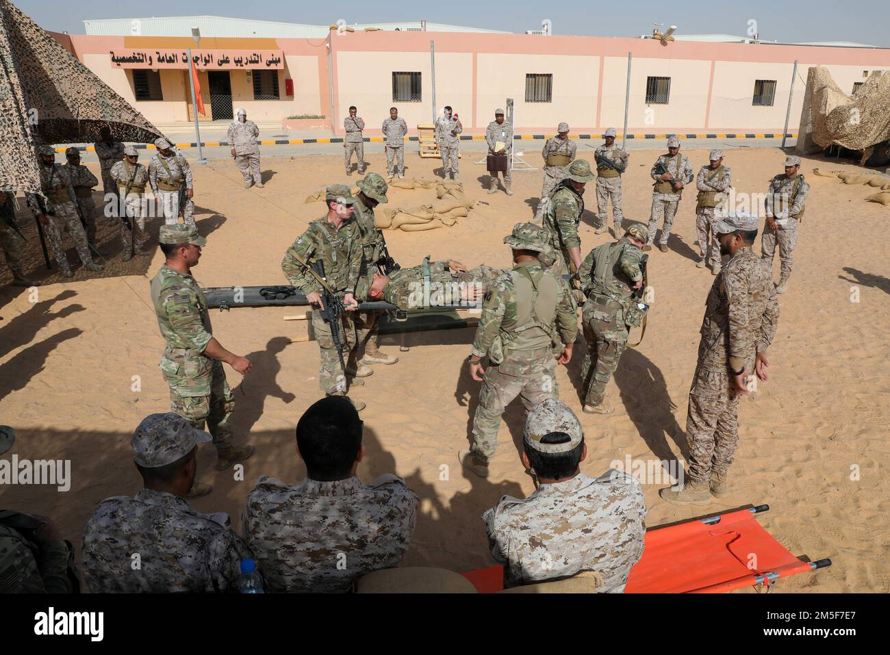 U.S. Soldiers assigned to the 1-124th Infantry Battalion, Task Force Hurricane and the Saudi Arabia Land Forces conduct platoon immersion at Al Kharj School of Transportation March 13th, 2022. Platoon Immersion is a training environment where two platoons from different countries merge together to build partnerships between the two nations. Stock Photo