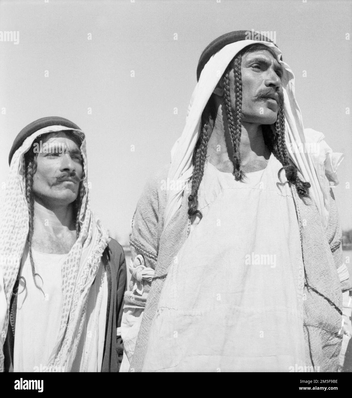 Middle East 1942: Two Yazidi recruits to the Iraqi Levies with plaited hair and Arab head-dresses and robes. These two volunteers are part of the Long Range Desert Group, the forerunner of todays SAS. Stock Photo