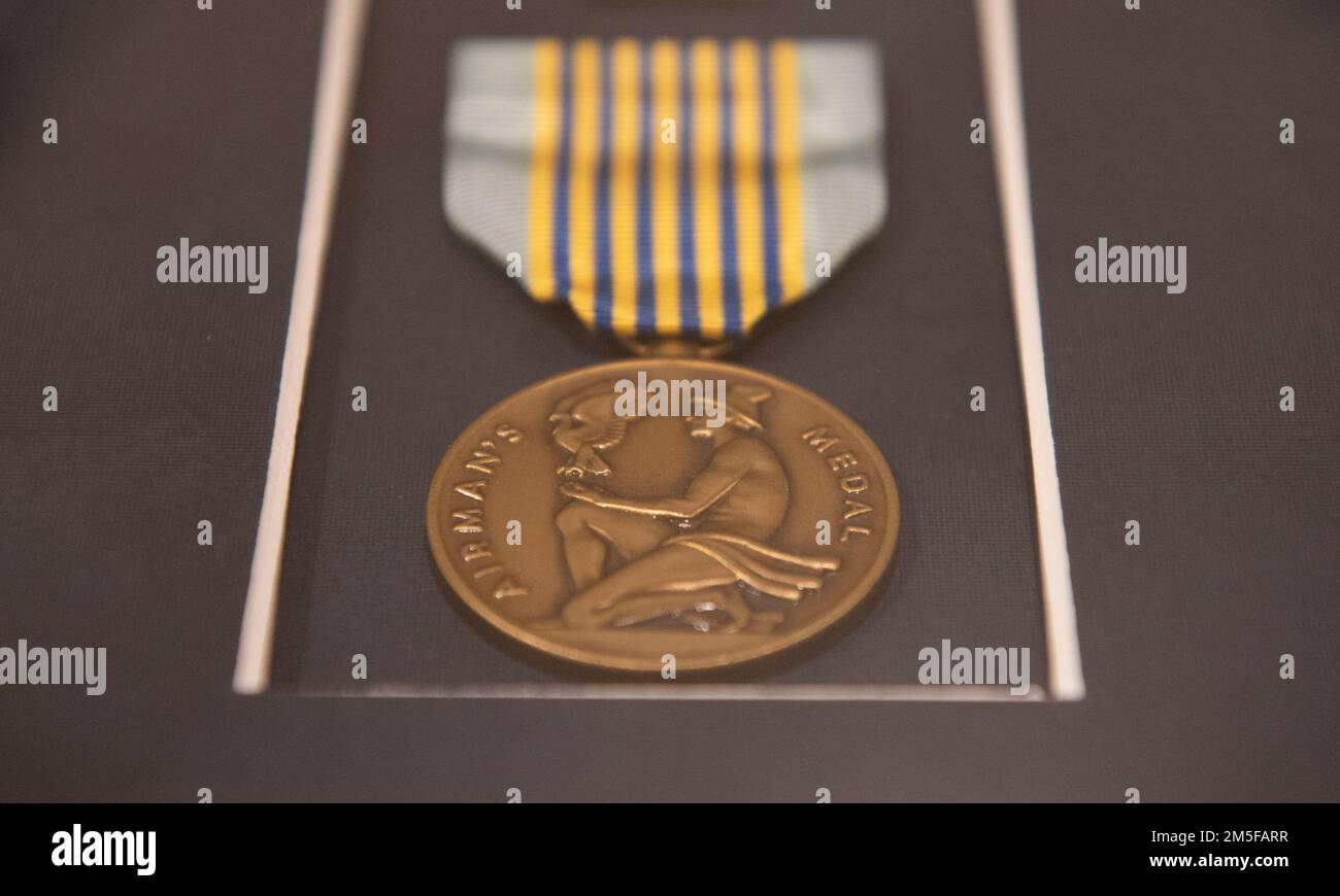 An Airman’s Medal rests prior to the ceremony for U.S. Air Force Capt. Christopher J.J. Adams at Moody Air Force Base, Georgia, March 11, 2022. Airman’s Medals are presented to military members who have distinguished themselves through heroic acts. Stock Photo