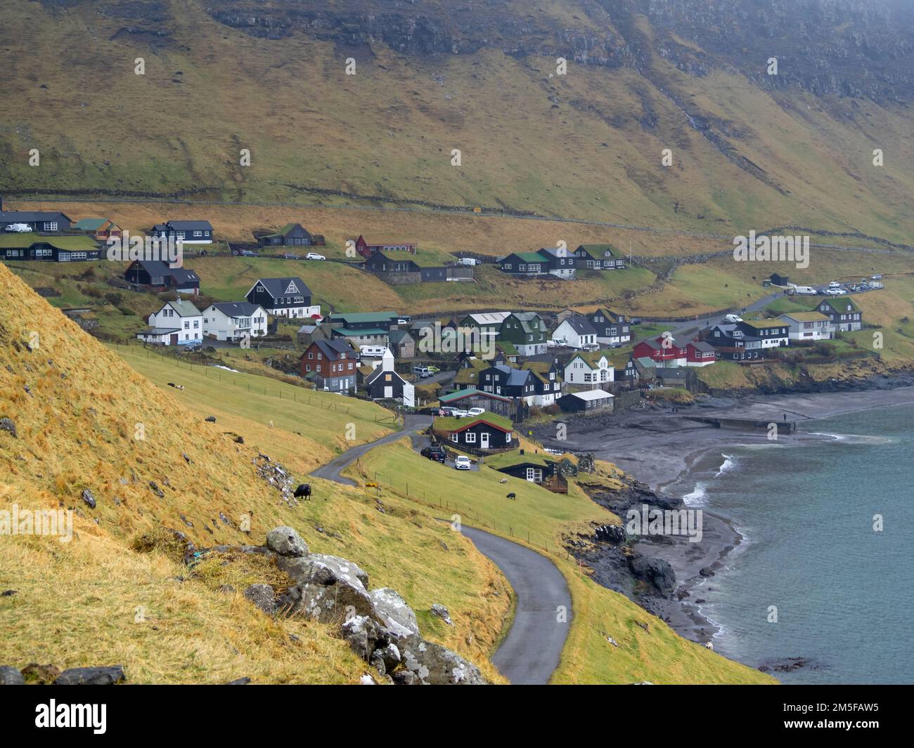 Yje Bøur village bt yje sea and bellow the mountain Stock Photo - Alamy