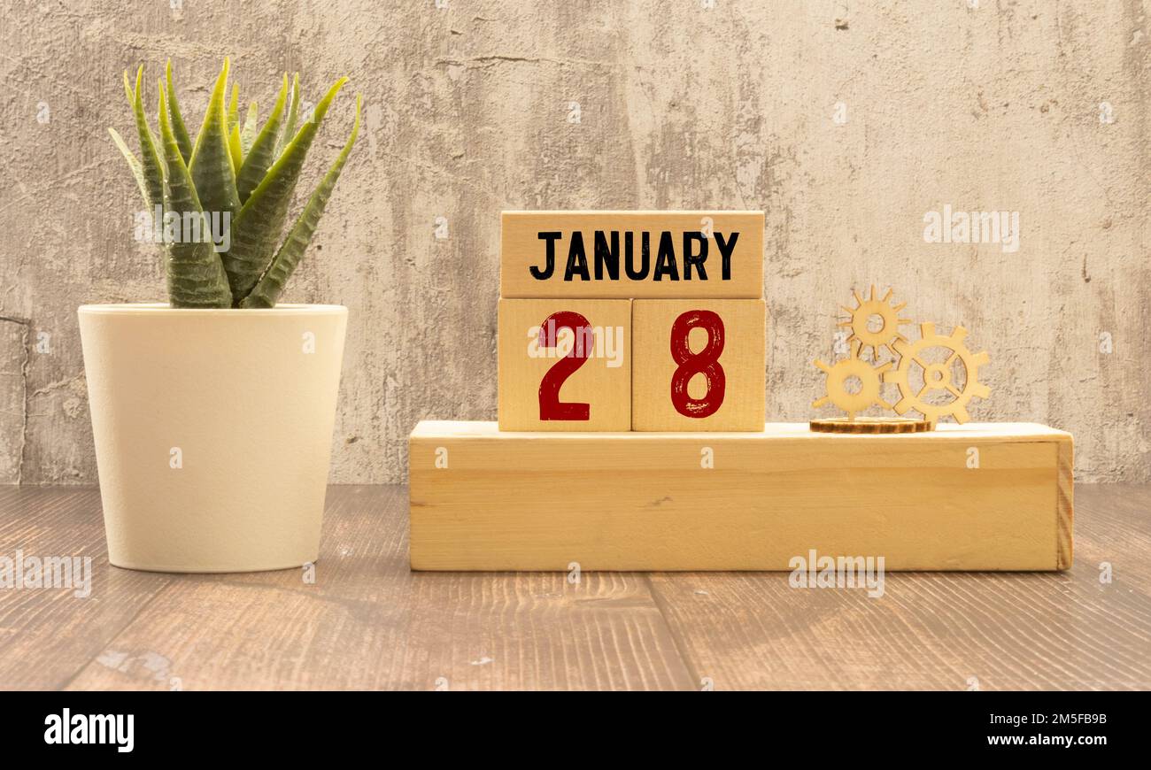 January 28 calendar date text on wooden blocks with blurred background