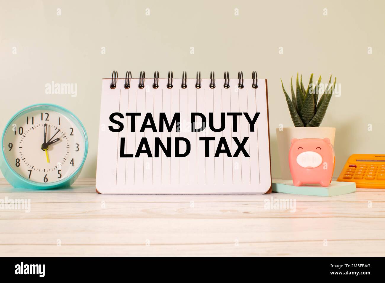 SDLT - Stamp Duty Land Tax write on a card on office desk. Stock Photo