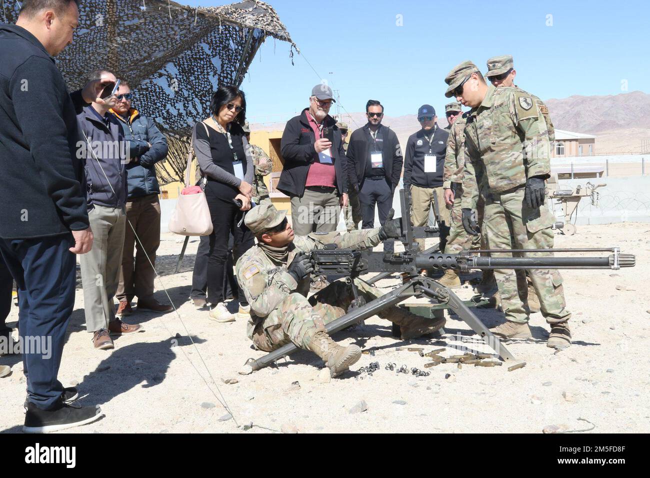 Soldiers with 11th Armored Cavalry Regiment show local medical executives an M2 .50 caliber machine gun March 11, during Weed Army Community Hospital’s Leadership Summit at Fort Irwin, Calif. (Photo by Kimberly Hackbarth/ Weed ACH Public Affairs Office) Stock Photo