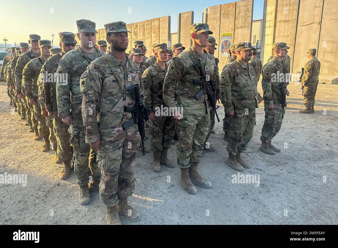 Erbil, Iraq. 17th Dec, 2022. U.S. Army Soldiers assigned to the 37th Infantry Brigade Combat Team Headquarters, Ohio National Guard, stand at attention after receiving their units shoulder sleeve insignia patch during a patching ceremony, Erbil Airbase, Iraq, December. 17, 2022. The ceremony was held to honor the Soldiers who were forward deployed with the 37th IBCT in support of Operation Inherent Resolve, awarding them the right to wear the right shoulder sleeve insignia of the 37th Buckeye Brigade. Credit: U.S. Army/ZUMA Press Wire Service/ZUMAPRESS.com/Alamy Live News Stock Photo