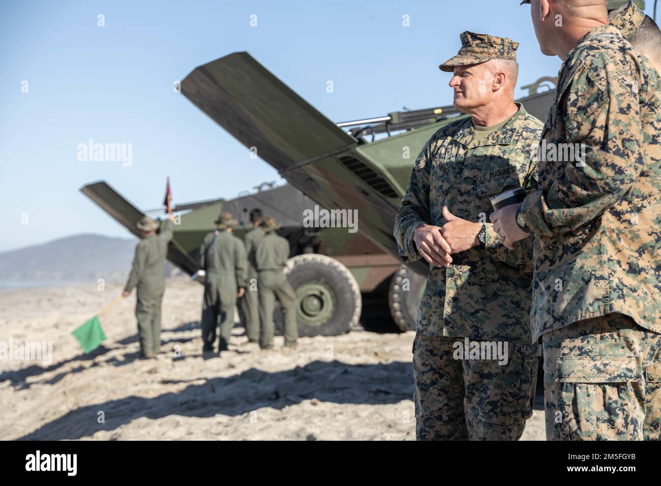 U.S. Marine Corps Maj. Gen. Roger B. Turner, the 1st Marine Division commanding general, observes a platoon of amphibious combat vehicles (ACV) traveling from shore to the USS Anchorage (LPD-23) at Marine Corps Base Camp Pendleton, California, March 12, 2022. The demonstration of proficiency in platoon-level operations marks the next step in certifying ACV crew members and their vehicles for worldwide deployment. Stock Photo
