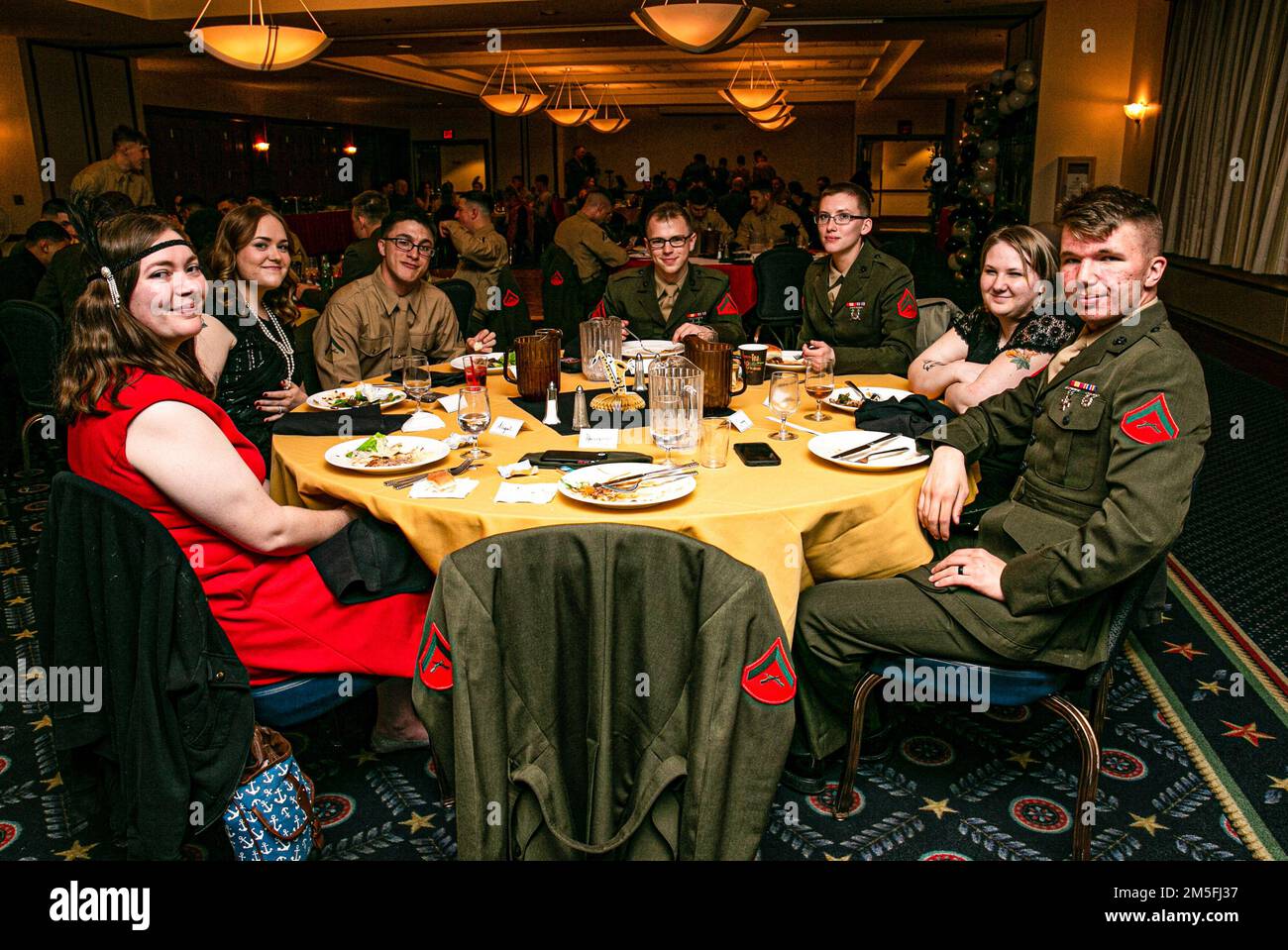 Andrews Air Force Base  – U.S. Marines with Chemical Biological Radiological Nuclear (CBRN) Alpha platoon had a formal dinner with family members aboard Andrews AFB, Md. CBRN Marines spent the night sustaining and reinforcing relationships with platoon and family members. (Official U.S. Marine Corps photo by Pfc. Angel Ponce/Released) Stock Photo