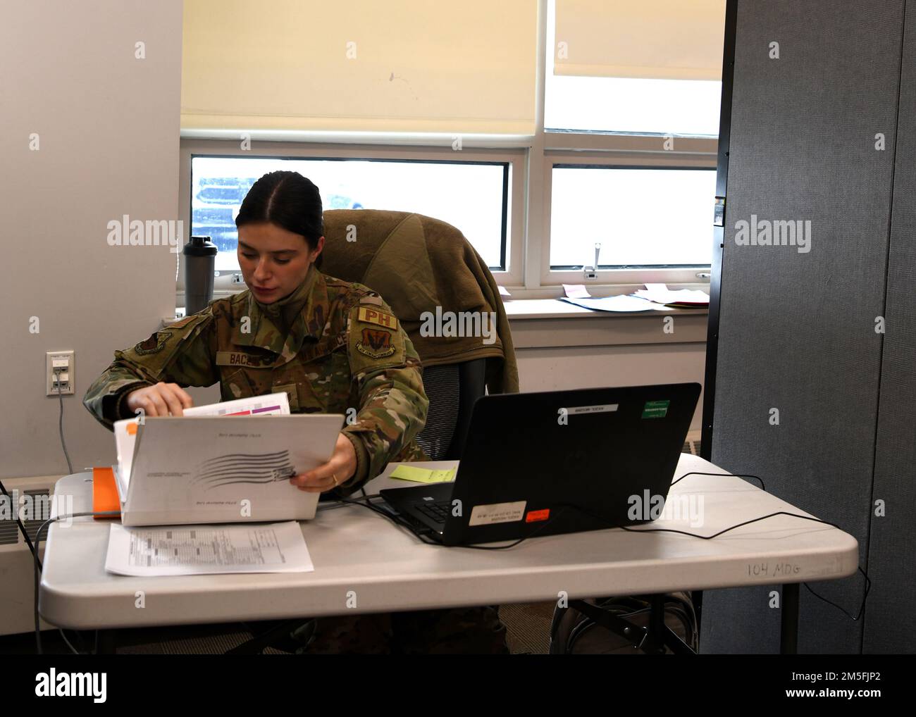 https://c8.alamy.com/comp/2M5FJP2/the-104th-medical-group-conducted-their-annual-phast-track-on-march-10-13-2022-during-the-preventative-health-assessments-the-104mdg-performs-audiograms-dental-exams-immunizations-draws-blood-for-lab-work-and-completes-an-assessment-of-each-members-overall-health-the-phast-track-ensures-the-readiness-of-the-104fw-and-saves-airmens-time-staff-sgt-weronika-baczek-104mdg-public-health-technician-checkouts-patients-during-the-phast-track-and-files-their-paperwork-us-air-national-guard-photos-by-master-sgt-lindsey-s-watson-2M5FJP2.jpg