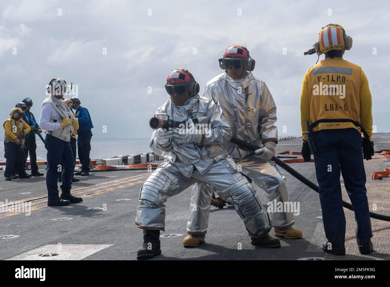 PHILIPPINE SEA (March 13, 2022) Sailors from the crash and salvage team ...