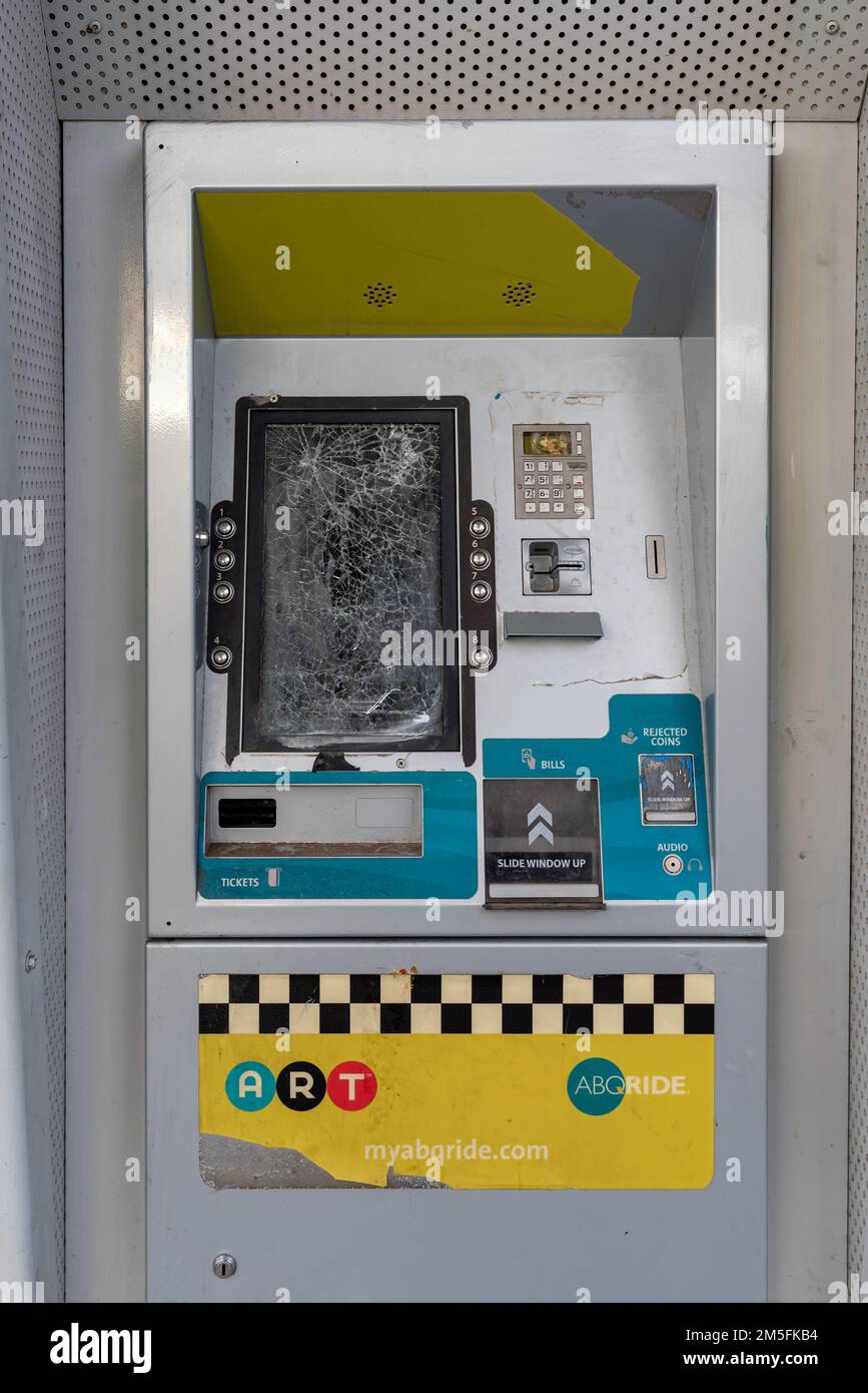A vandalized ticket machine for the ART bus on Nob Hill in Santa Fe, New Mexico. Stock Photo