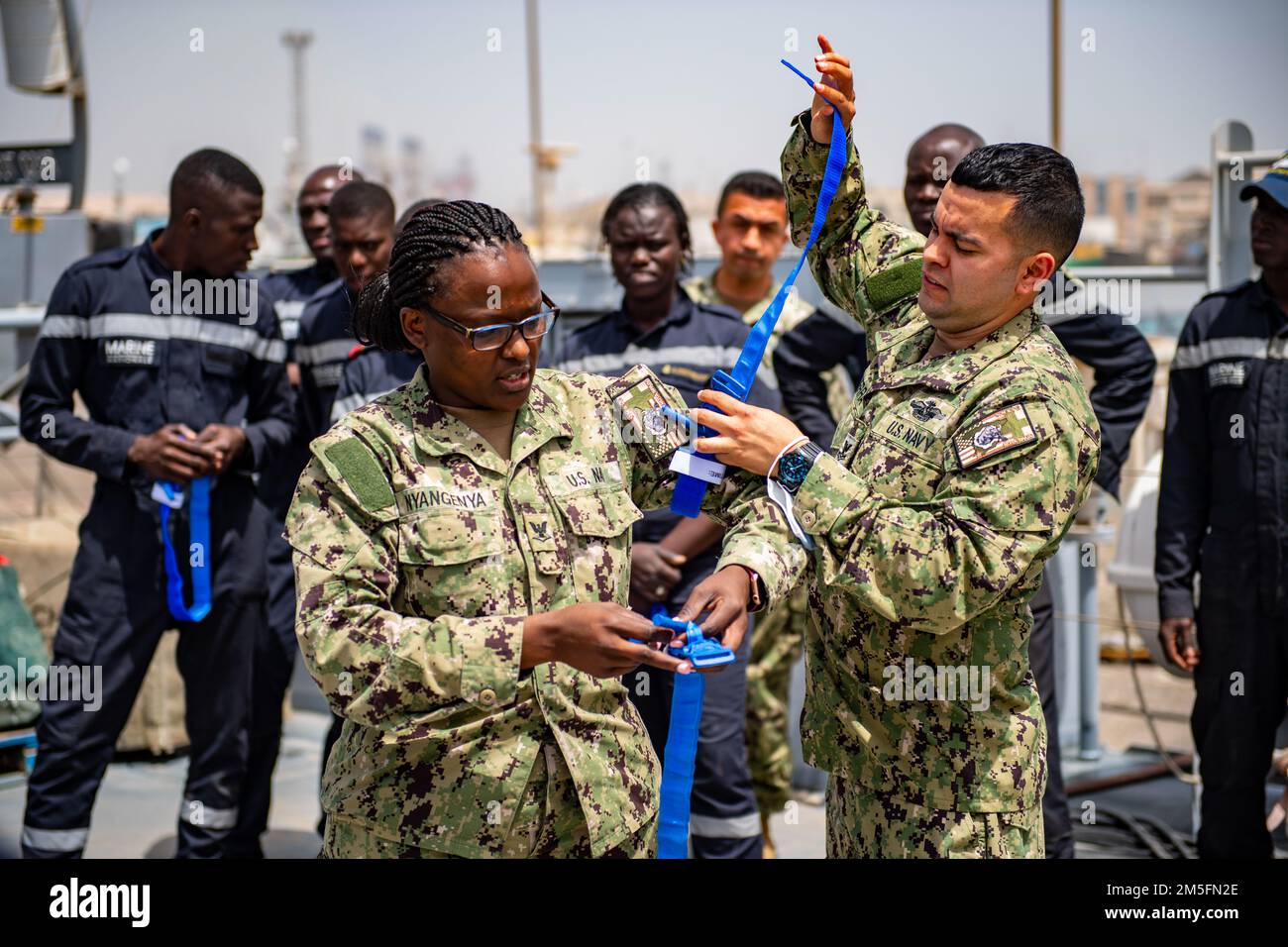 220314-N-ZA688-0144    DAKAR, Senegal (March 14, 2022) Hospital Corpsman 2nd Class Alexis Guerra (right) and 3rd Class Mary Nyangenya conduct medical training onboard the Senegalese Navy's patrol ship, Fouladou, as part of the Exercise Obangame Express in Dakar, Senegal, Mar. 14, 2022. Obangame Express 2022, conducted by U.S. Naval Forces Africa, is an at-sea maritime exercise designed to improve cooperation among participating nations in order to increase maritime safety and security in the Gulf of Guinea and West Africa coastal regions. U.S. Sixth Fleet, headquartered in Naples, Italy, condu Stock Photo