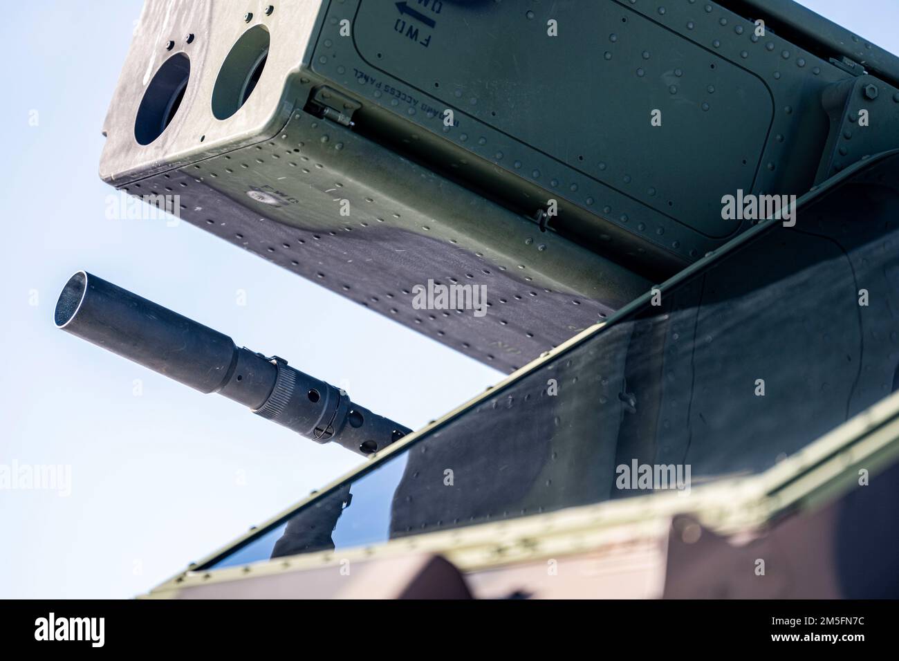 An Avenger air defense system turret tracks an F-16 in flight during ...