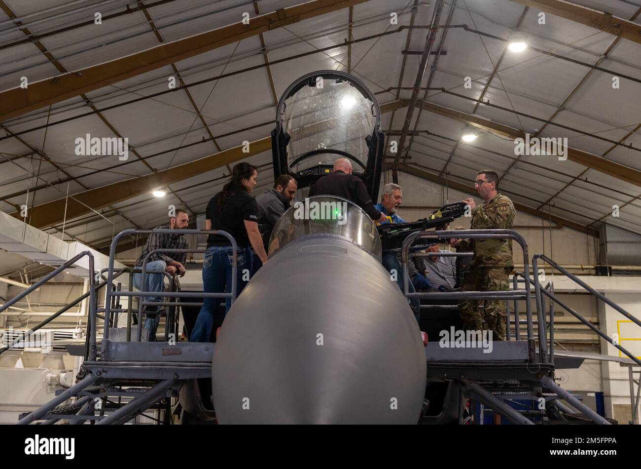 Engineers install modular ejection seat components on an F-15E Strike ...