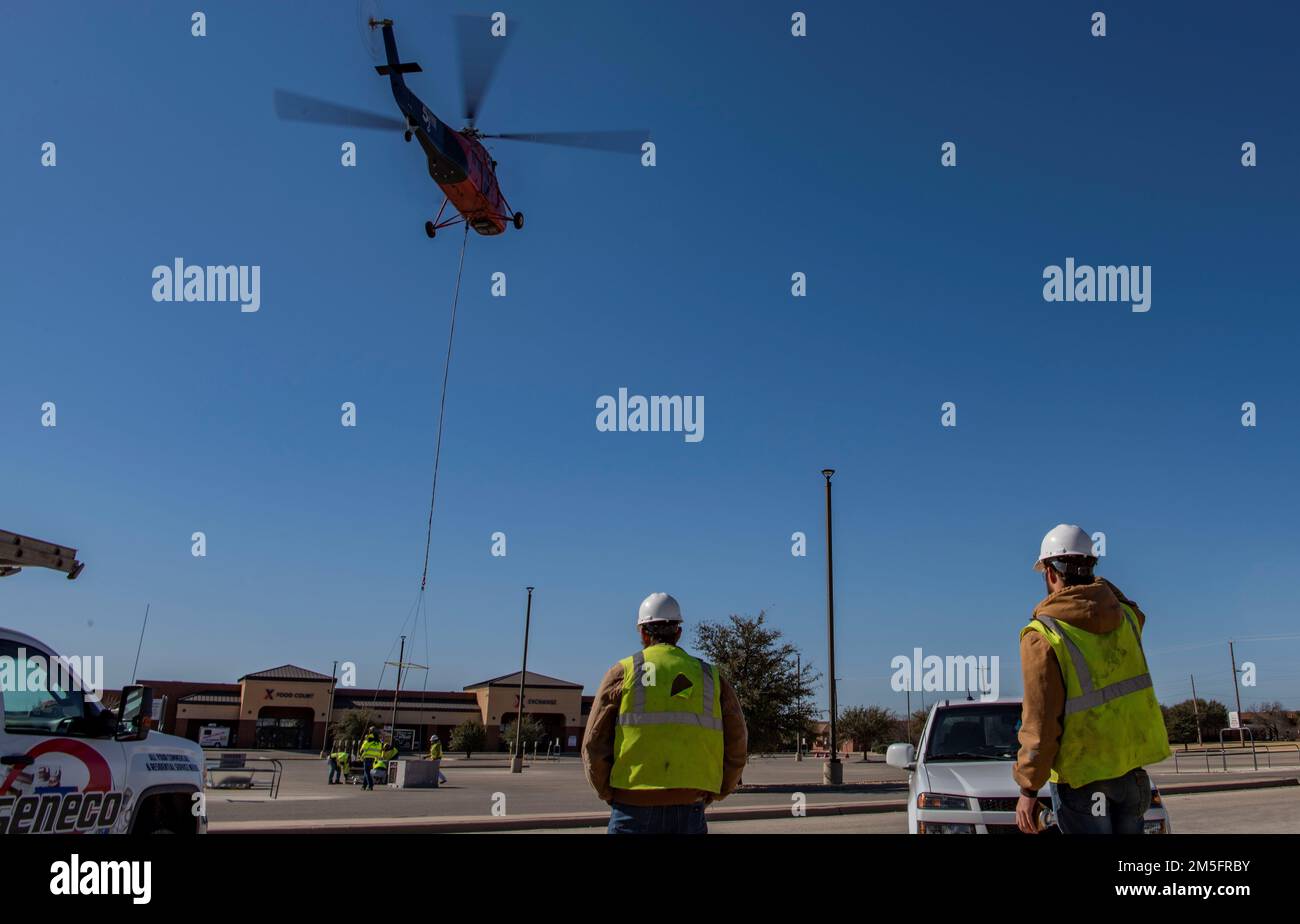 A helicopter from 5 State Helicopter Inc. flies over the Base Exchange